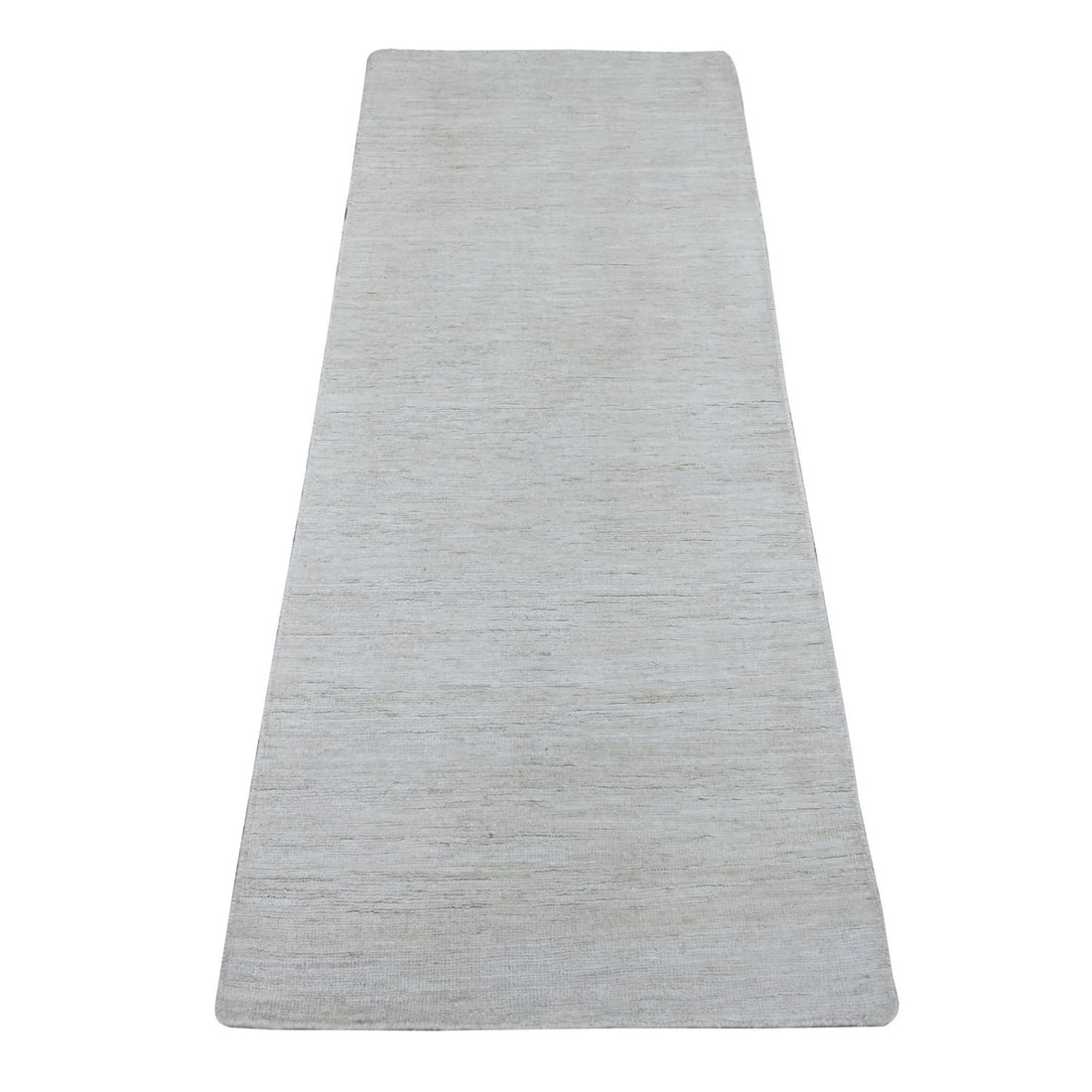 Ivory solid hand knotted wool ghazni rug: Ivory solid hand knotted wool ghazni rug The Ivory solid hand knotted wool Ghazni rug boasts a stunning ivory color and intricate hand-knotted weave, showcasing exceptional craftsmanship. Made from hi