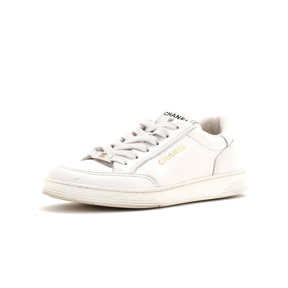 CC Logo Leather Low Top Sneakers Women's Chanel: CC Logo Leather Low Top Sneakers Women's Chanel White leather CC logo low-top sneakers from Chanel, featuring gold hardware and a classic design. With some signs of wear, including creasing, scuffs, a