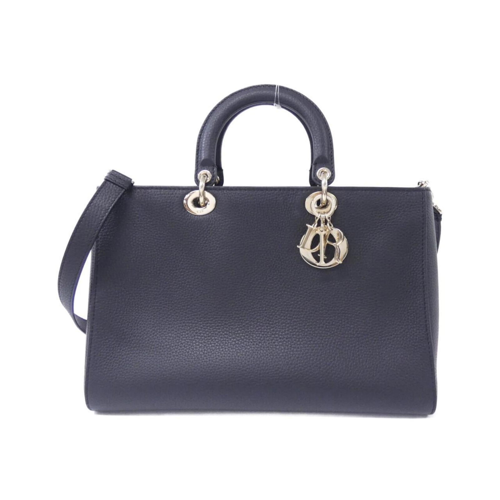 Christian Dior Handbag Leather: Christian Dior Handbag Leather This beautiful black Christian Dior handbag features high-quality leather and gold hardware, exuding timeless elegance. With its classic design and spacious interior, th
