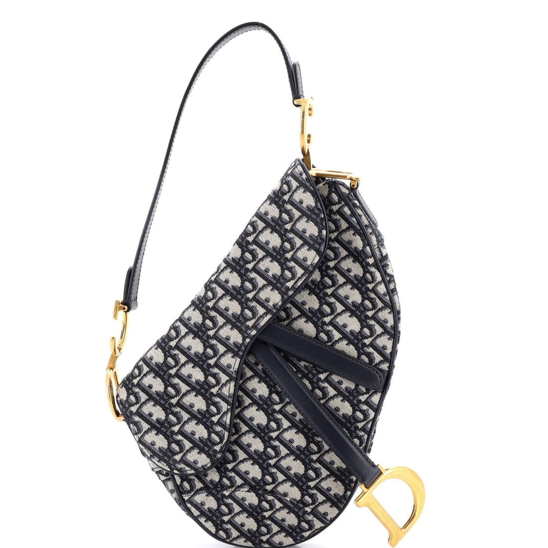 Canvas oblique medium saddle handbag Christian Dior: Canvas oblique medium saddle handbag Christian Dior Canvas oblique medium saddle handbag from Christian Dior features a striking blue canvas exterior with minor creases and discoloration. The bag's