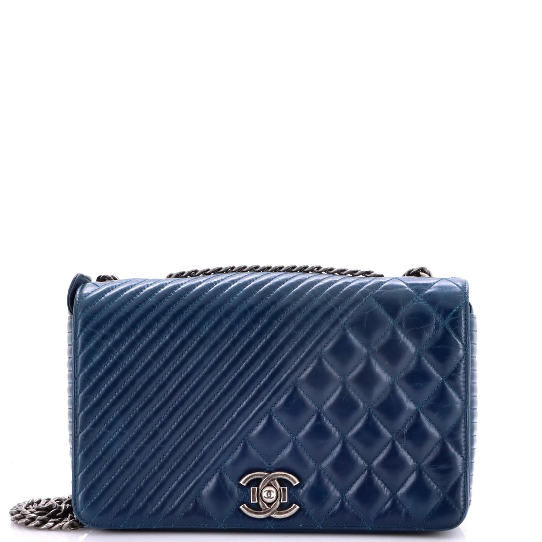 Coco Boy Flap Bag Quilted Aged Calfskin Medium Chanel: Coco Boy Flap Bag Quilted Aged Calfskin Medium Chanel The Coco Boy Flap Bag features quilted aged calfskin exterior in blue, with red interior and aged silver hardware. This medium-sized bag boasts a 