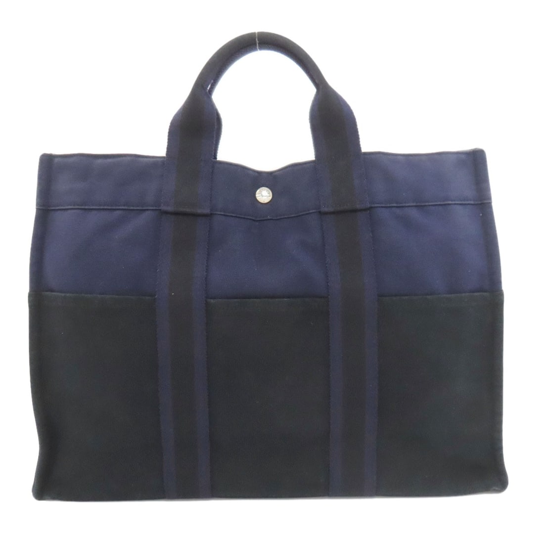 Canvas Handbag Hermes Sukhool Tomm: Canvas Handbag Hermes Sukhool Tomm Canvas Handbag with Navy Exterior. This Herm?s Sukhool Tomm handbag features canvas exterior material and navy color, characteristic of its style. A classic design p