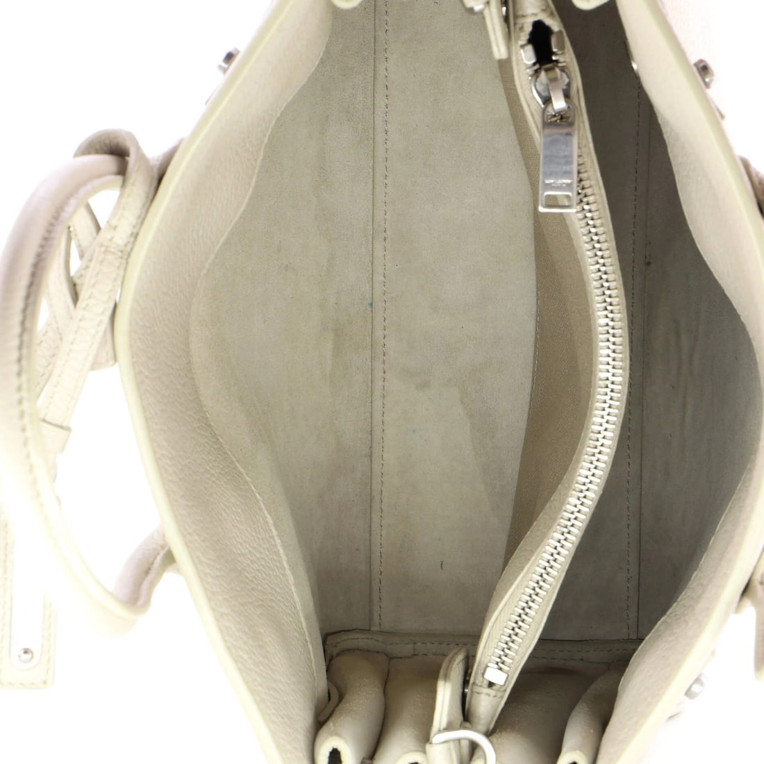 Sac de jour souple Saint Laurent baby leather bag: Sac de jour souple Saint Laurent baby leather bag The Sac de jour souple Saint Laurent baby leather bag features neutral exterior color and suede interior, with aged silver hardware. This stylish top-