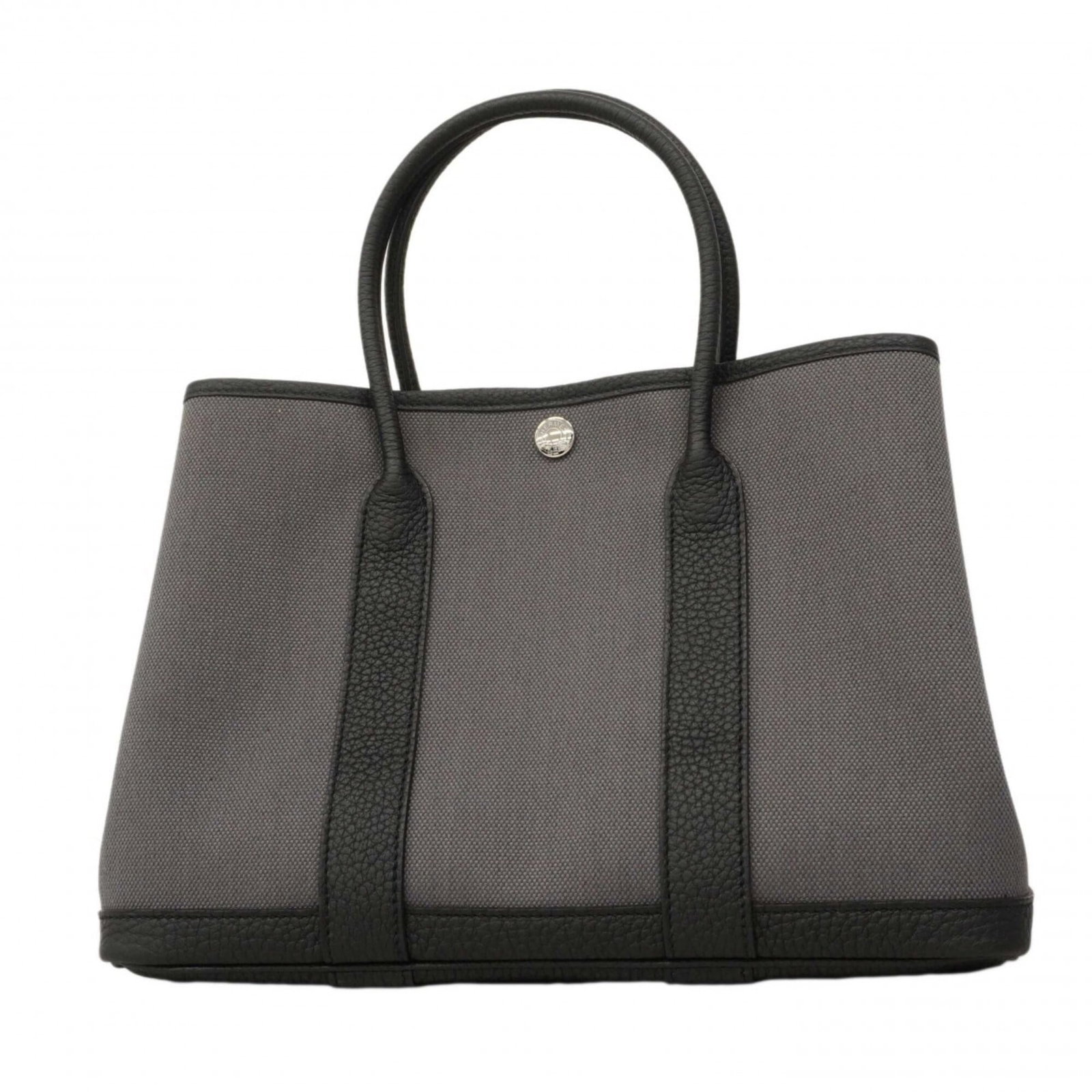 Hermes Tote Bag: Hermes Tote Bag The iconic Hermes Tote Bag in sleek black leather features silver hardware for a timeless and sophisticated look. With its classic design and spacious interior, this versatile tote is 