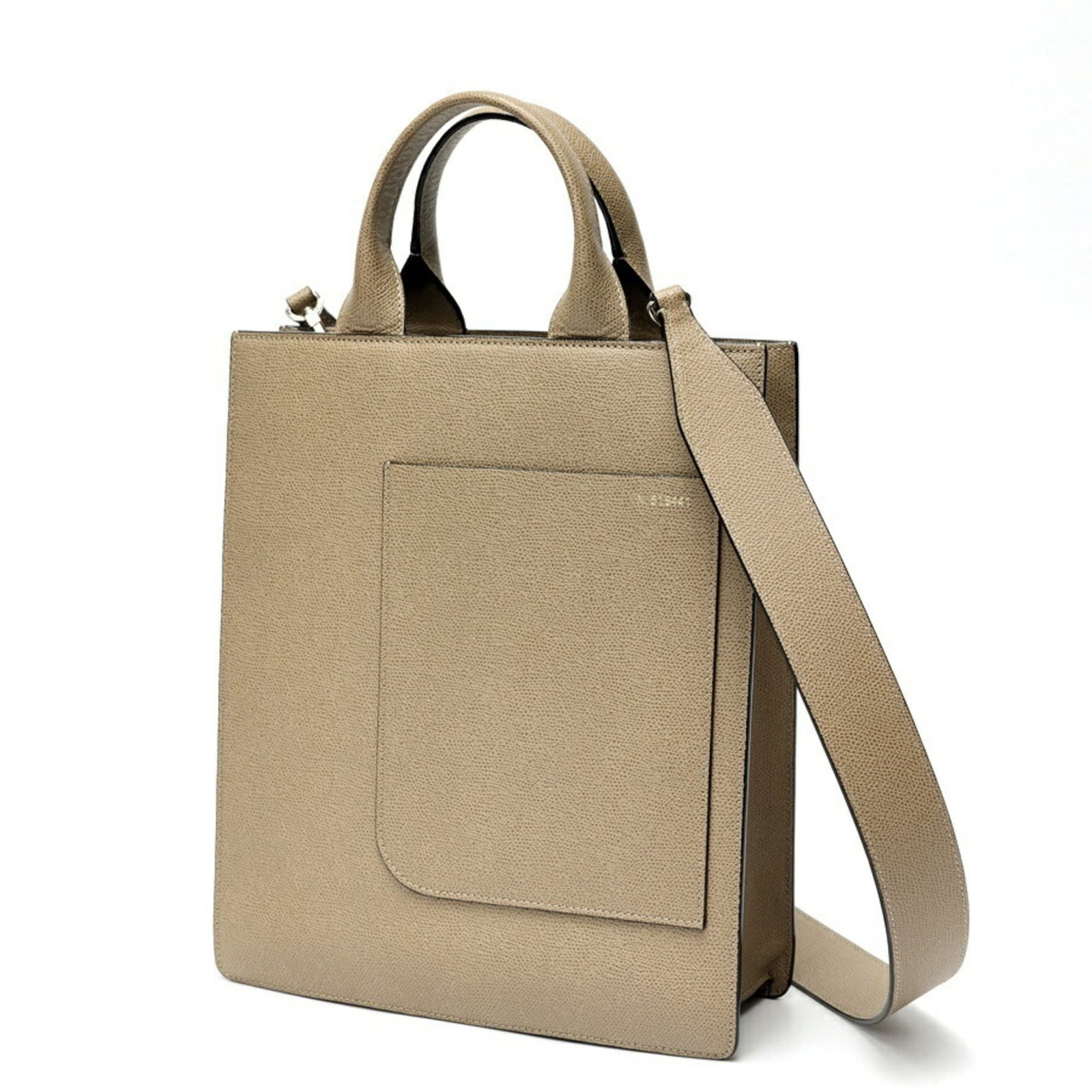 Valextra Tote Bag Leather: Valextra Tote Bag Leather The Valextra Tote Bag Leather features a timeless grayish hue and premium leather construction. With its classic design and compact size, this versatile tote bag is perfect f