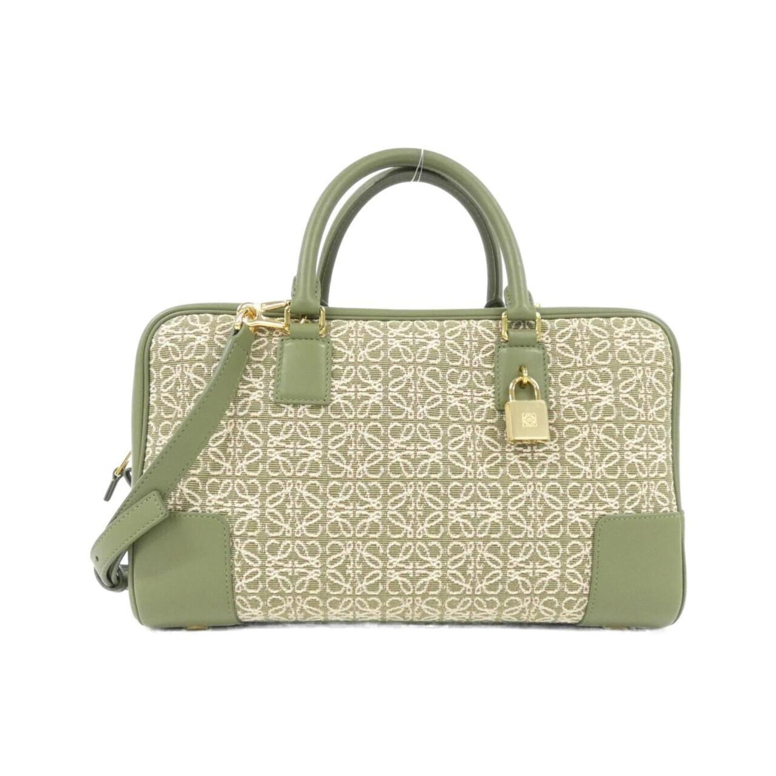 Loewe Handbag Canvas Leather: Loewe Handbag Canvas Leather Canvas and leather blend in this unique Loewe handbag, featuring calfskin accents. The beige and green color combination adds a touch of elegance to its classic design. Wi