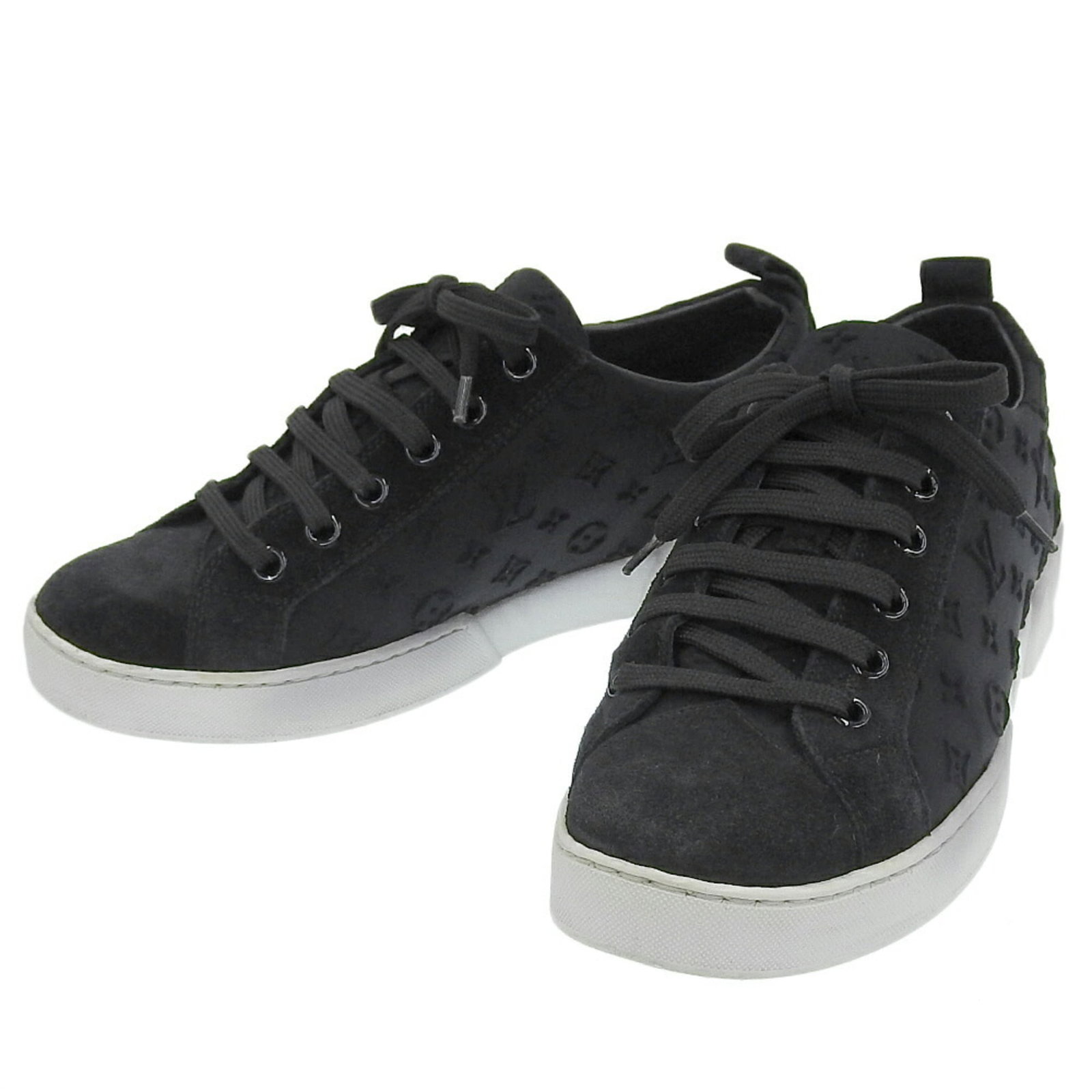 Louis Vuitton Sneakers: Louis Vuitton Sneakers Black Louis Vuitton Sneakers in very good condition, with some minor scratches and dirt visible. The sneakers bear a signature, indicating they are a unique piece. Overall, a gr