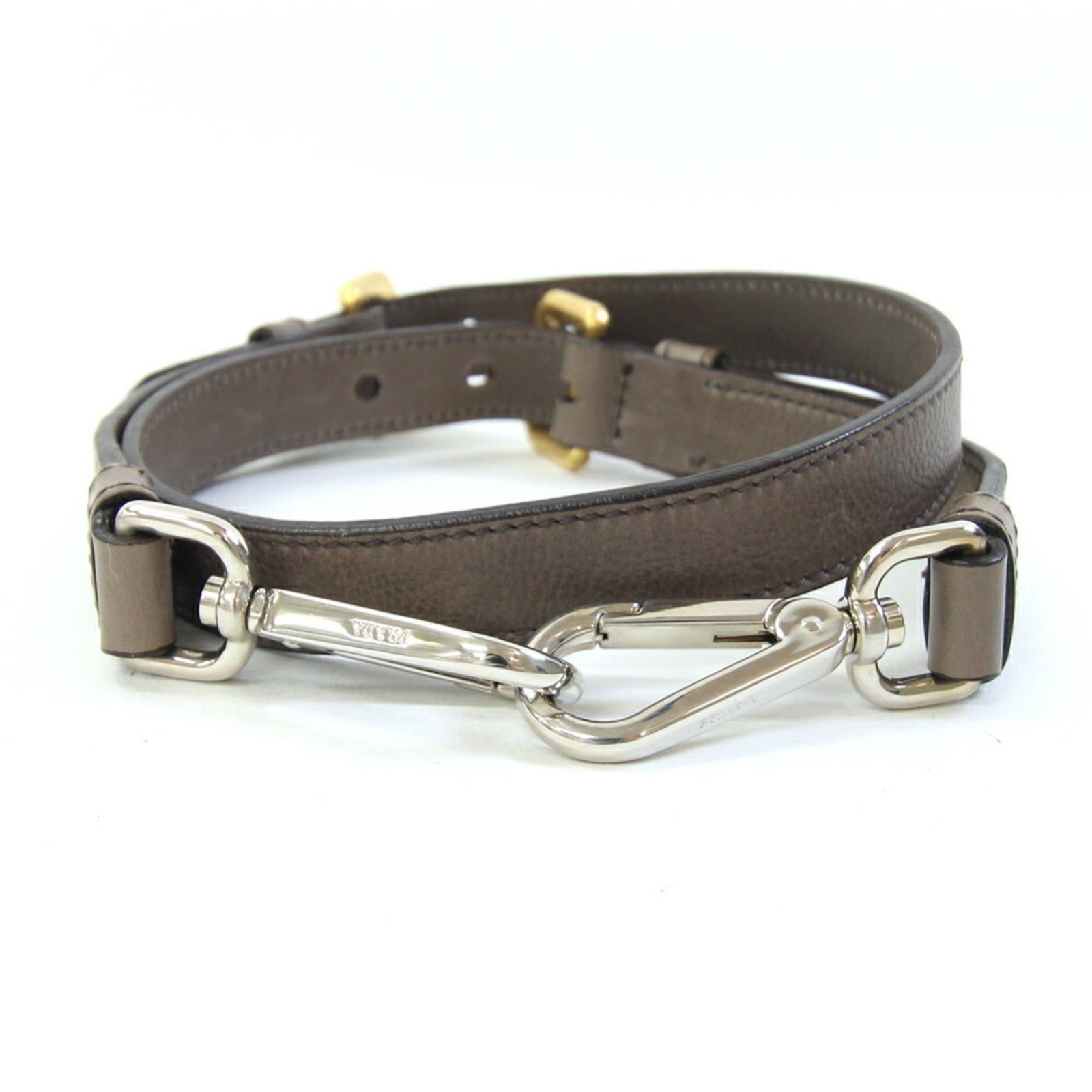 Prada Strap Leather: Prada Strap Leather The Prada Strap Leather is a brown leather strap with a size of 85cm x 2cm. It has traces of usage and minor scratches/dirt, but remains in good condition overall. This used Prada