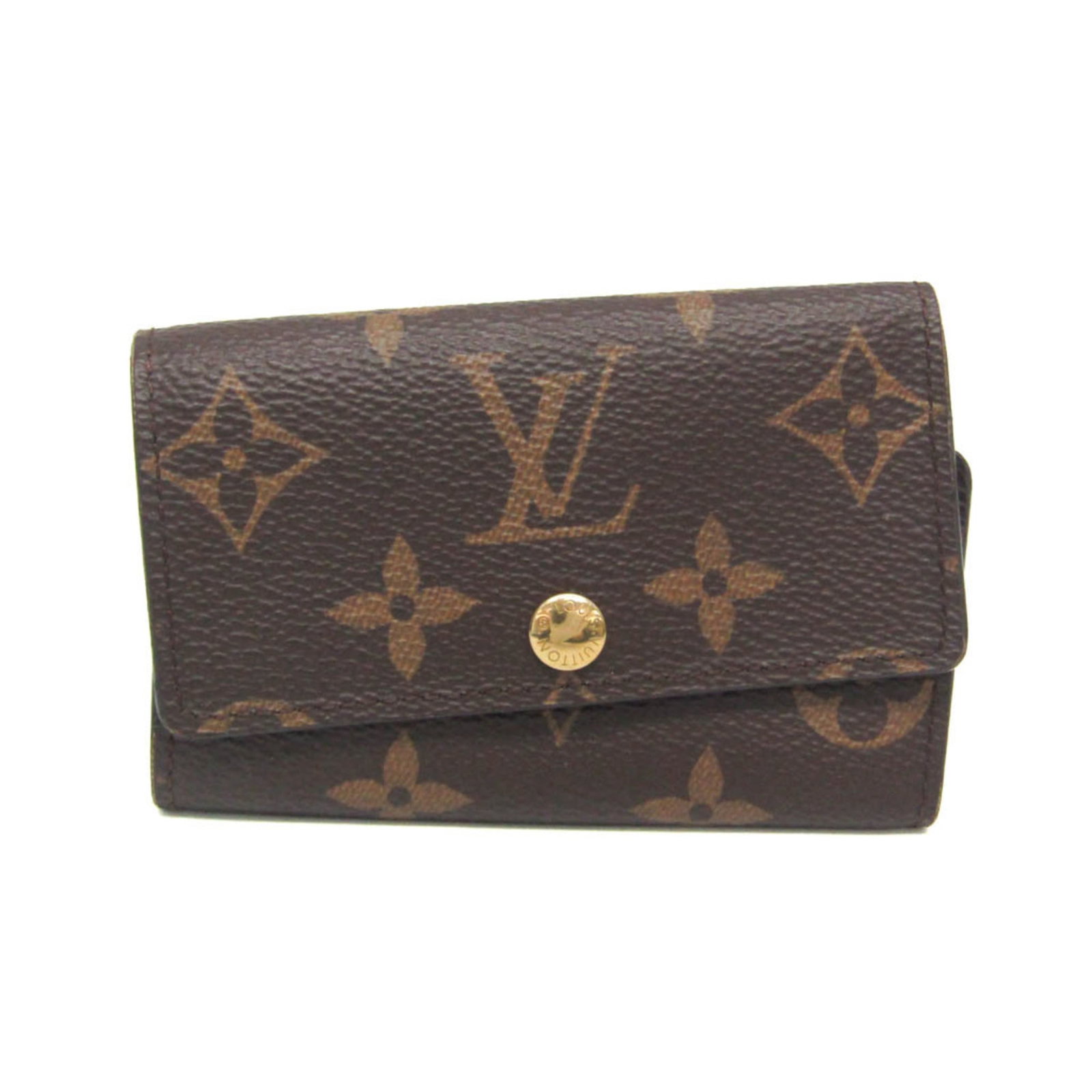 Louis Vuitton Keycase Monogram: Louis Vuitton Keycase Monogram The Louis Vuitton Keycase Monogram in brown features a classic snap closure and six key hooks. With its iconic monogram pattern, this stylish accessory has been used to 