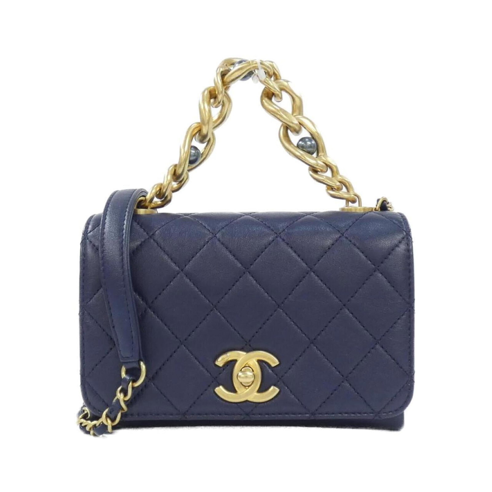 Chanel Shoulder Bag Leather: Chanel Shoulder Bag Leather Navy leather shoulder bag from Chanel features matte gold hardware and a classic design. With its calfskin material and compact size, this bag is perfect for everyday use. 
