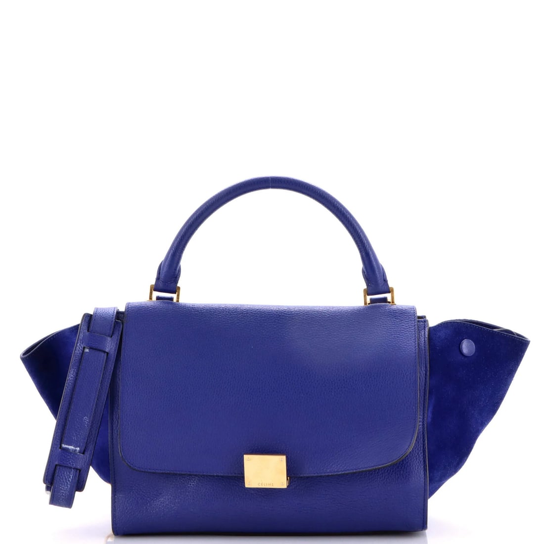 Small Leather Celine Trapeze Bag: Small Leather Celine Trapeze Bag The Celine Trapeze Bag boasts a striking blue exterior with gold hardware, featuring a classic top handle design. Made from high-quality leather, this small bag measur