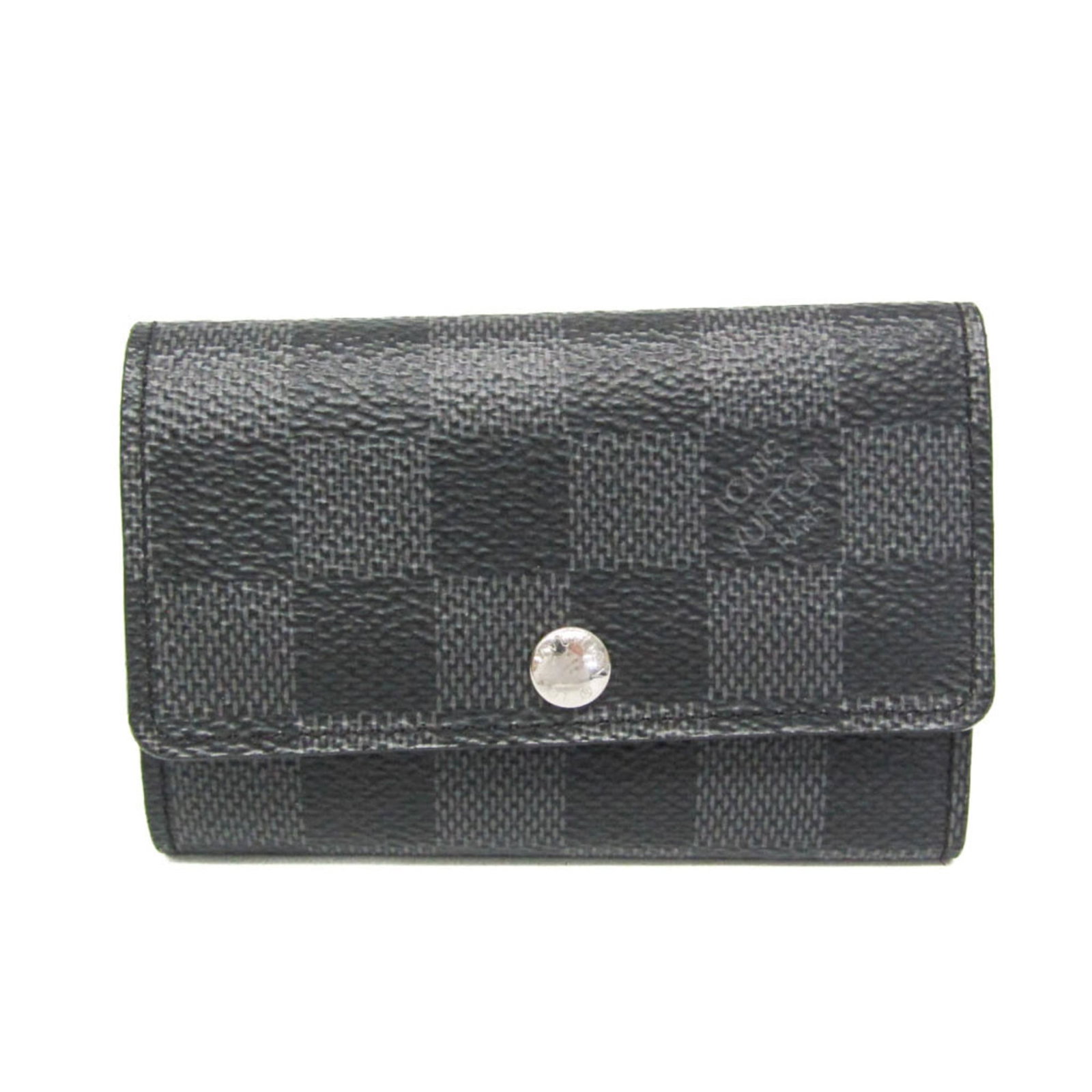 Louis Vuitton Keycase Damier Graphite: Louis Vuitton Keycase Damier Graphite Damier Graphite leather wraps around this Louis Vuitton Keycase, adding a touch of timeless elegance to daily essentials. With six key hooks and a snap closure,
