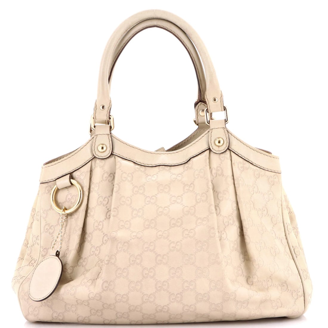 Tote Guccissima Leather Medium by Gucci: Tote Guccissima Leather Medium by Gucci The Guccissima Leather Medium Tote boasts a neutral exterior with subtle scuffs and edge wear, giving it a worn-in charm. With its medium size and silver