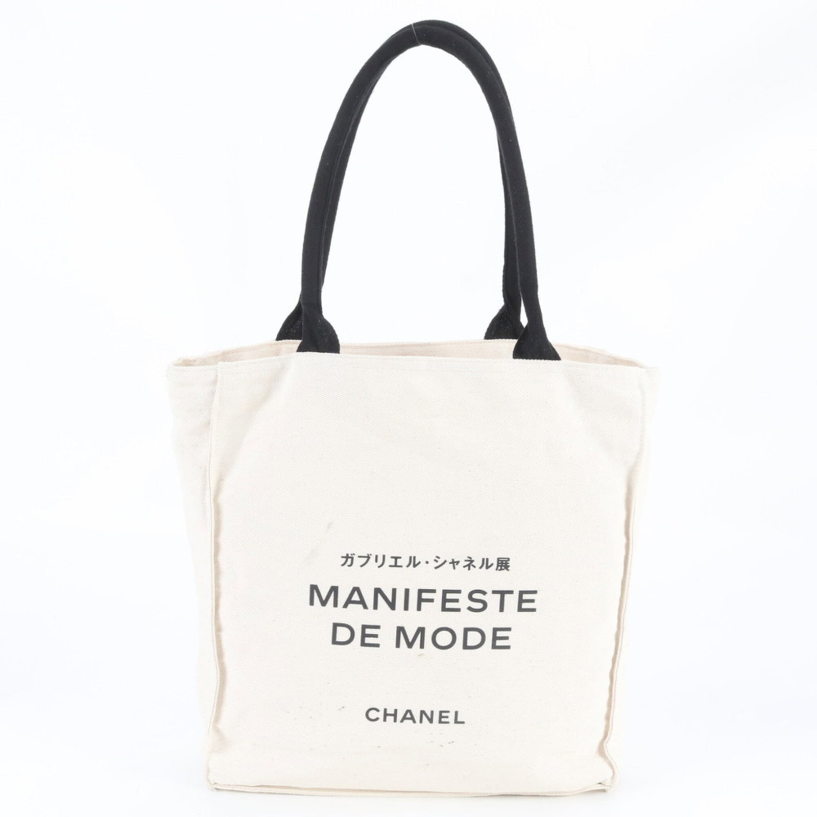 Chanel Tote Bag Canvas: Chanel Tote Bag Canvas Canvas tote bag from Chanel in black and white. The bag features a classic design with a canvas material and dimensions of 34cm x 33cm x 11cm. It has been used and shows traces 