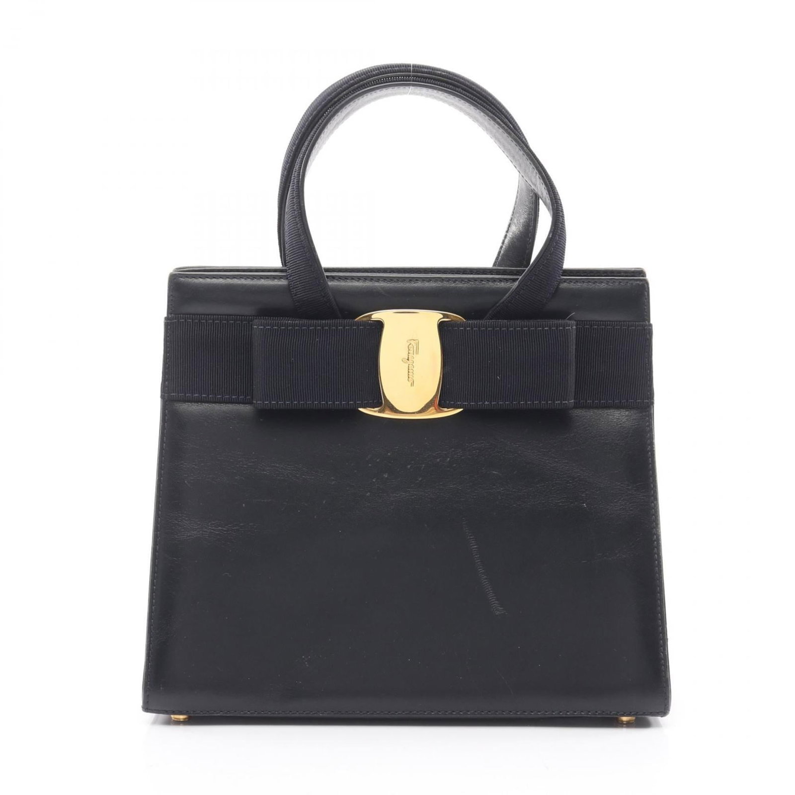 Salvatore Ferragamo Handbag Leather: Salvatore Ferragamo Handbag Leather Navy leather Salvatore Ferragamo handbag with classic design, available in used condition. The bag features scratches and dirt from previous use, but remains