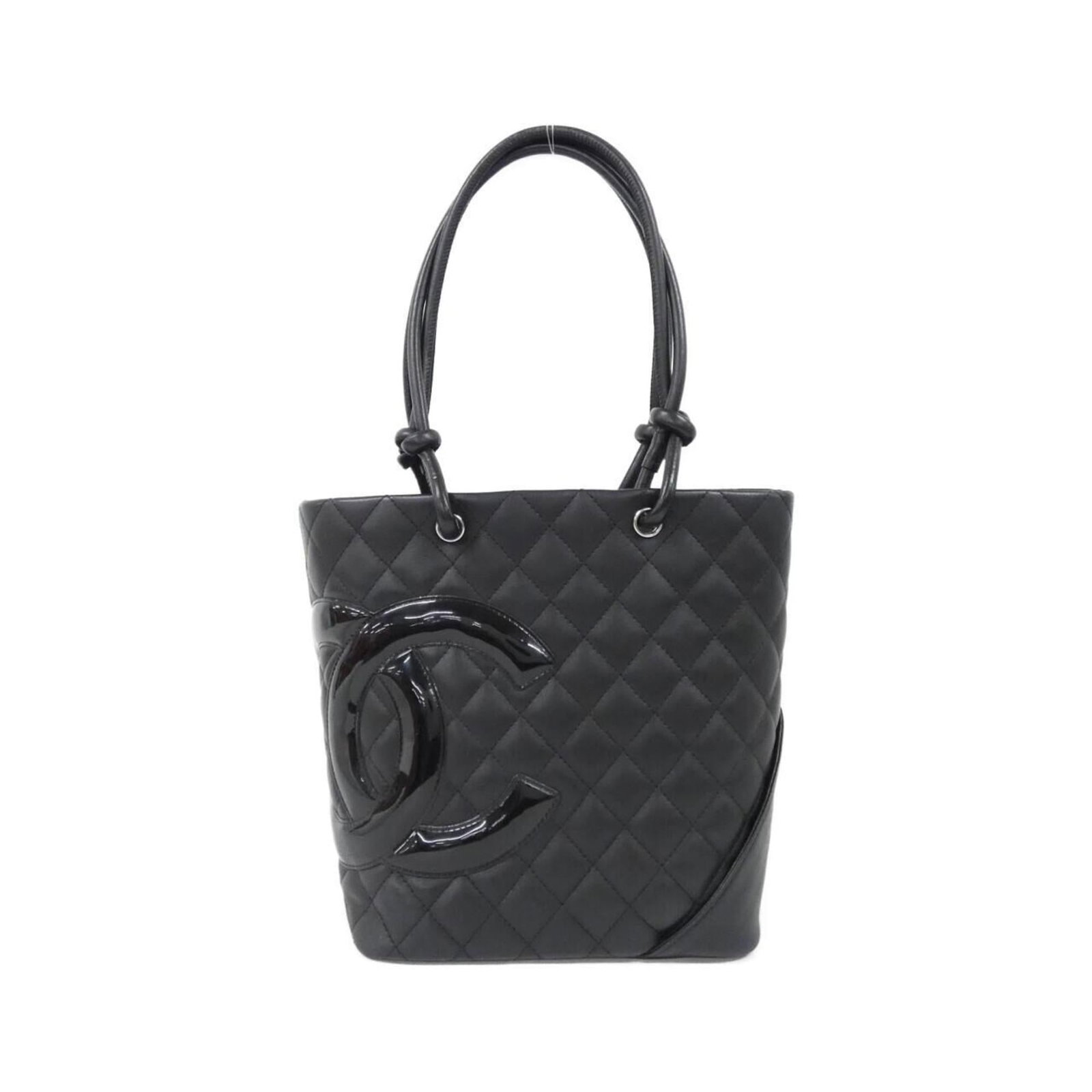 Chanel Handbag Leather: Chanel Handbag Leather The Chanel Handbag Leather features classic calfskin construction and sleek silver hardware in a timeless black finish. With its compact size and durable leather material, this