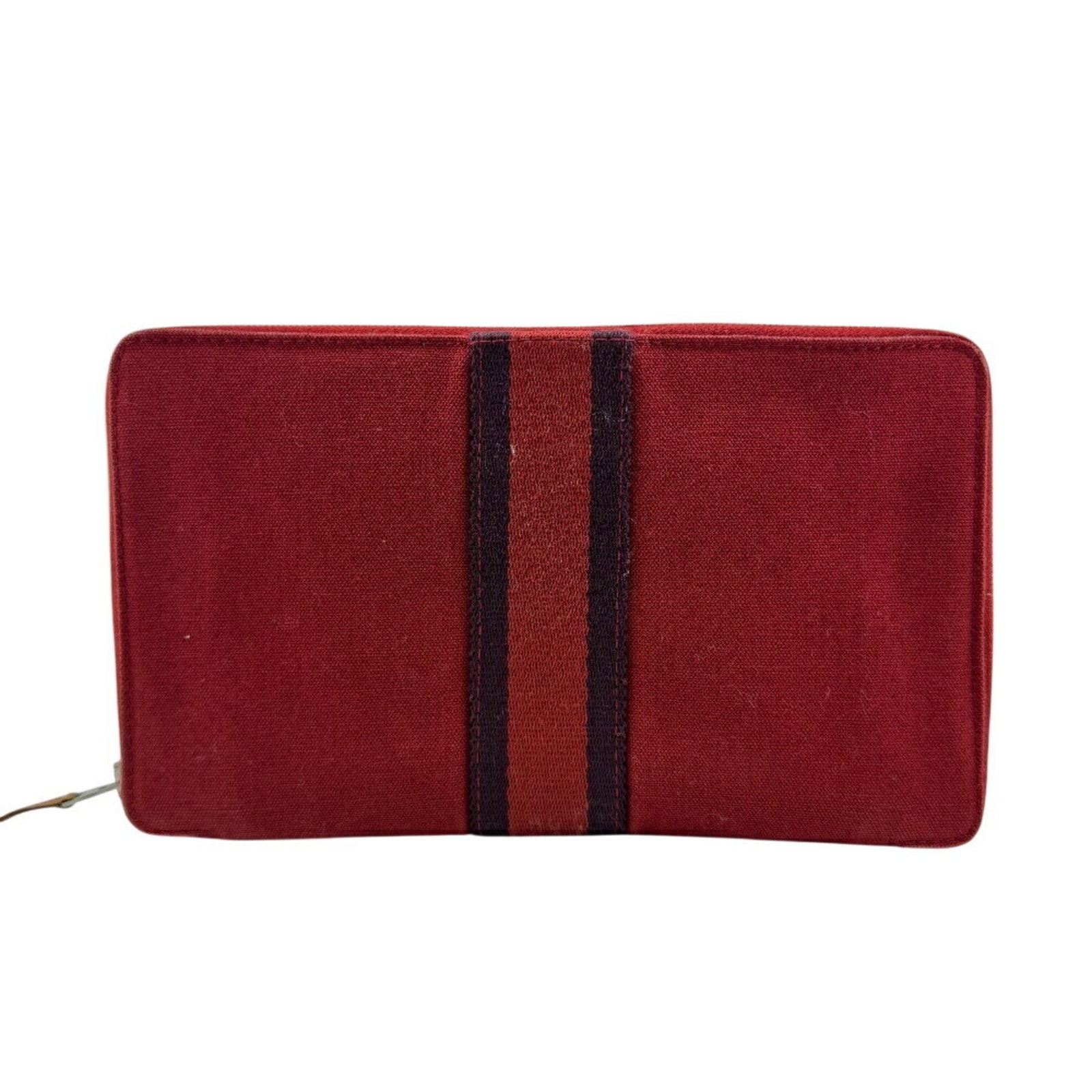 Hermes Long Wallet (Bi-Fold) Cotton: Hermes Long Wallet (Bi-Fold) Cotton Red cotton bi-fold wallet from Hermes with a classic design and long dimensions. The used condition shows traces of usage and minor scratches, giving it a worn-in l