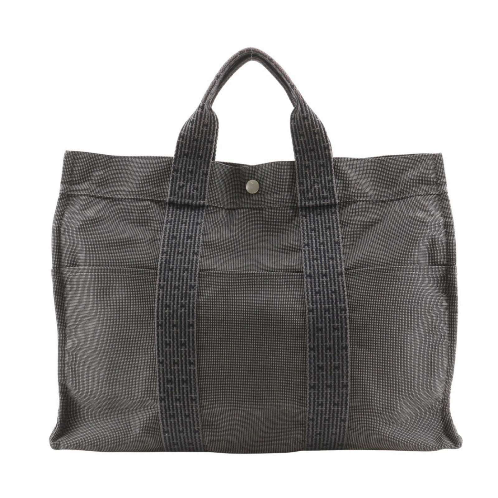 Hermes Handbag Tote Bag Nylon Canvas: Hermes Handbag Tote Bag Nylon Canvas Gray Hermes Handbag Tote Bag in Nylon Canvas. This used tote bag features a durable nylon canvas material and measures 32cm x 43cm x 11cm. With traces of usage vis