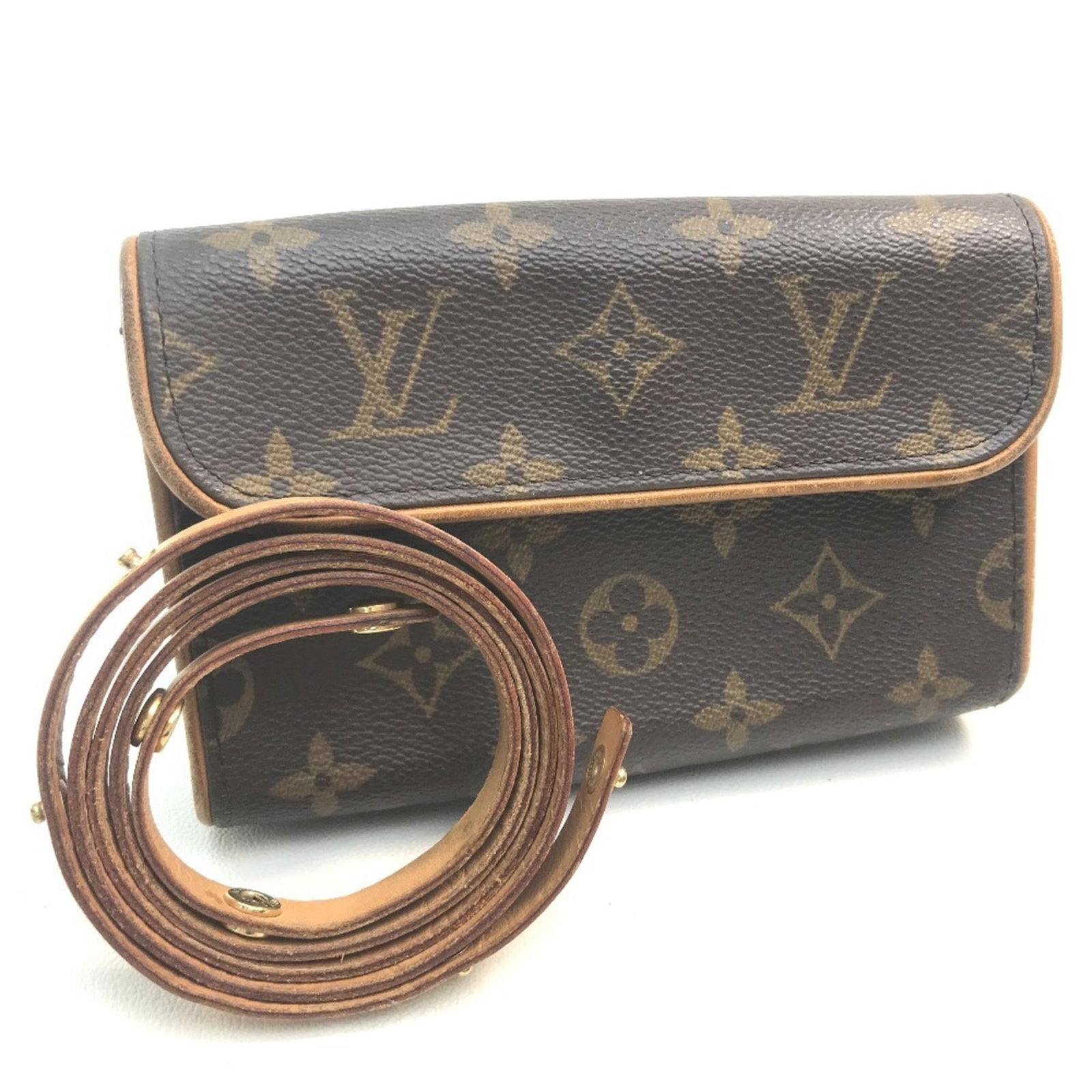 Louis Vuitton Fanny Pack Pochette Pouch Monogram: Louis Vuitton Fanny Pack Pochette Pouch Monogram This Louis Vuitton Fanny Pack Pochette Pouch Monogram in brown features the iconic brand's signature monogram pattern. With its classic design and