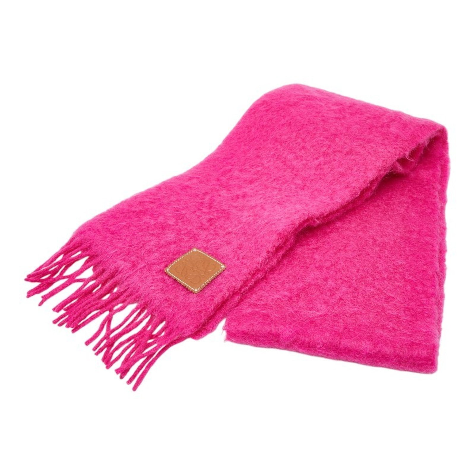 Loewe Stole Wool Nylon Mohair: Loewe Stole Wool Nylon Mohair The Loewe Stole Wool Nylon Mohair is a vibrant pink women's stole made from a unique blend of wool, nylon, and mohair. Measuring 21cm x 1.94m in size, this used item