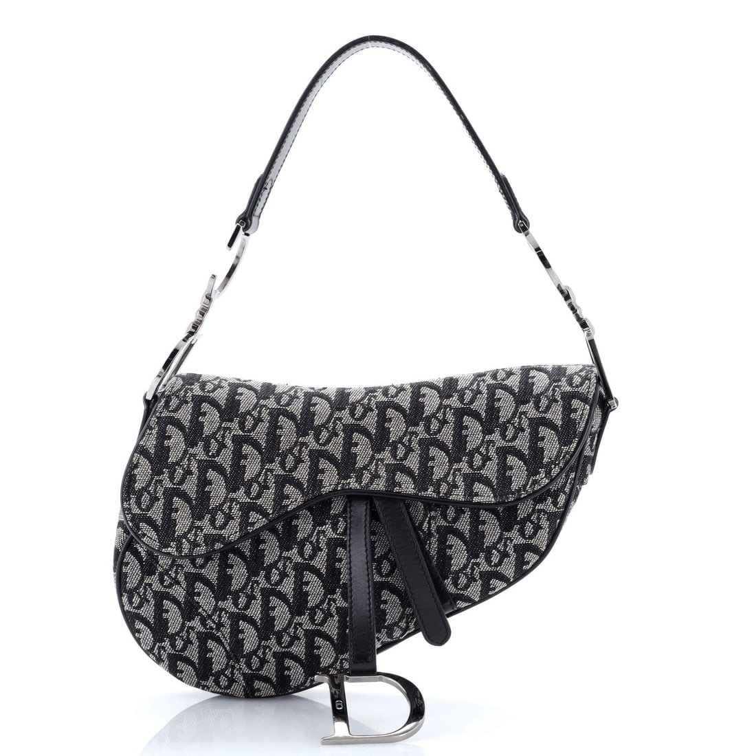 Christian Dior Saddle Bag Dior Vintage: Christian Dior Saddle Bag Dior Vintage The Christian Dior Saddle Bag in black canvas exudes timeless elegance with its classic design and sleek silhouette. Featuring silver hardware and a medium