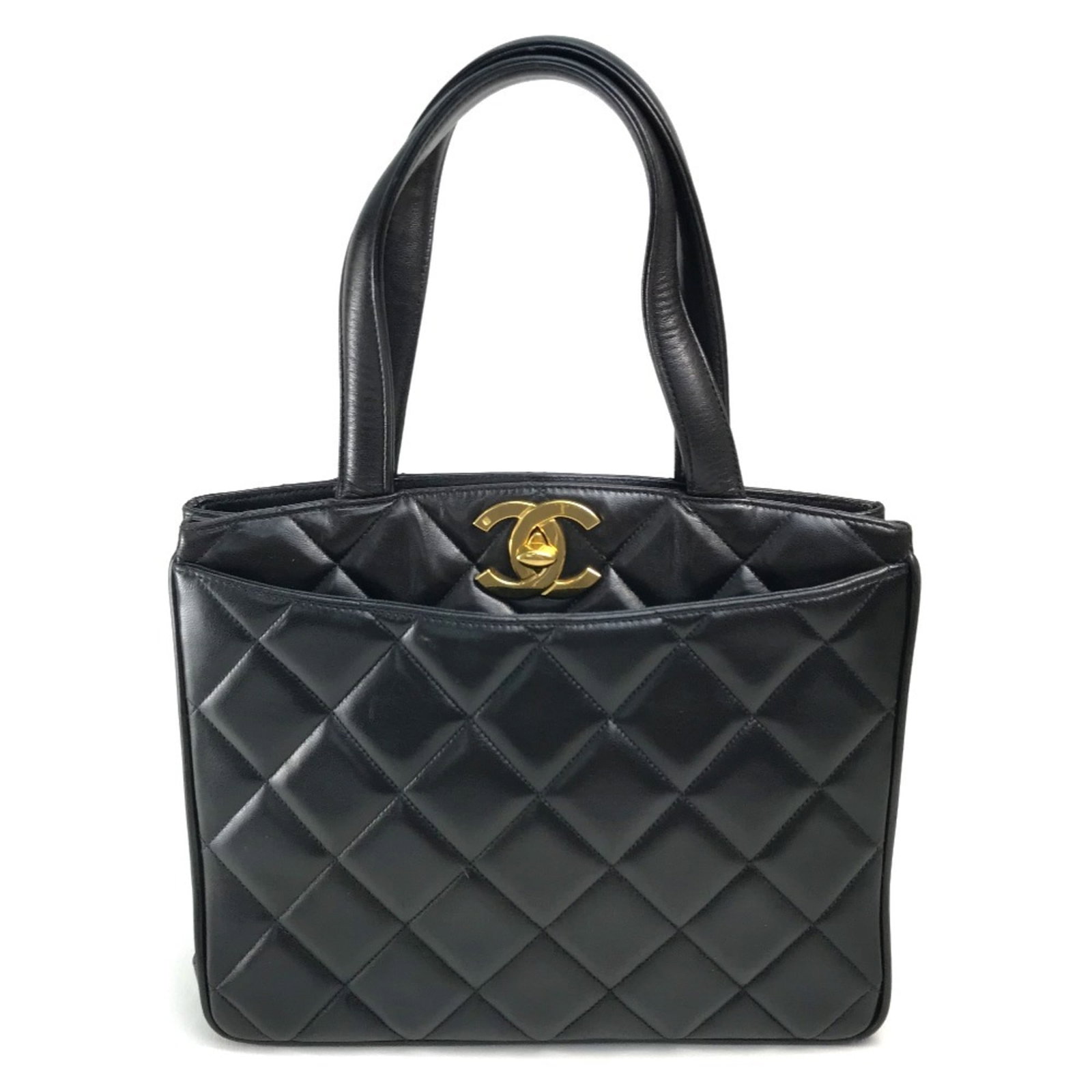 Chanel Handbag Tote Bag Leather: Chanel Handbag Tote Bag Leather This black Chanel handbag tote bag features high-quality lambskin leather and gold hardware, making it a timeless and sophisticated accessory. With its classic design