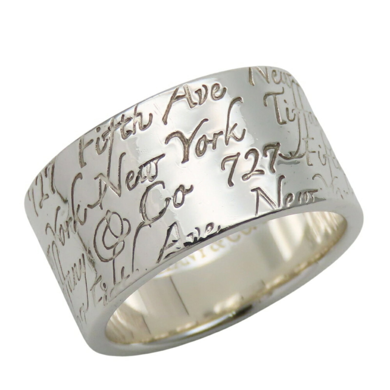 Tiffany Band Ring Silver 925: Tiffany Band Ring Silver 925 Silver Tiffany Band Ring with 925 Material. This used band ring features silver material and has a distinctive Tiffany brand. Traces of usage are present, including scratc