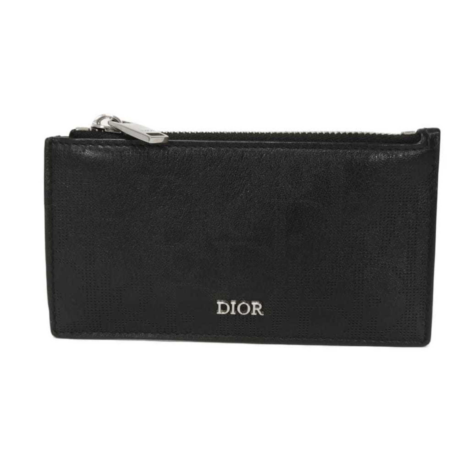 Christian Dior Card Case Leather: Christian Dior Card Case Leather Smooth Calf Leather Christian Dior Card Case in Black features a classic design with traces of usage and minor scratches. The card case's smooth leather material gives