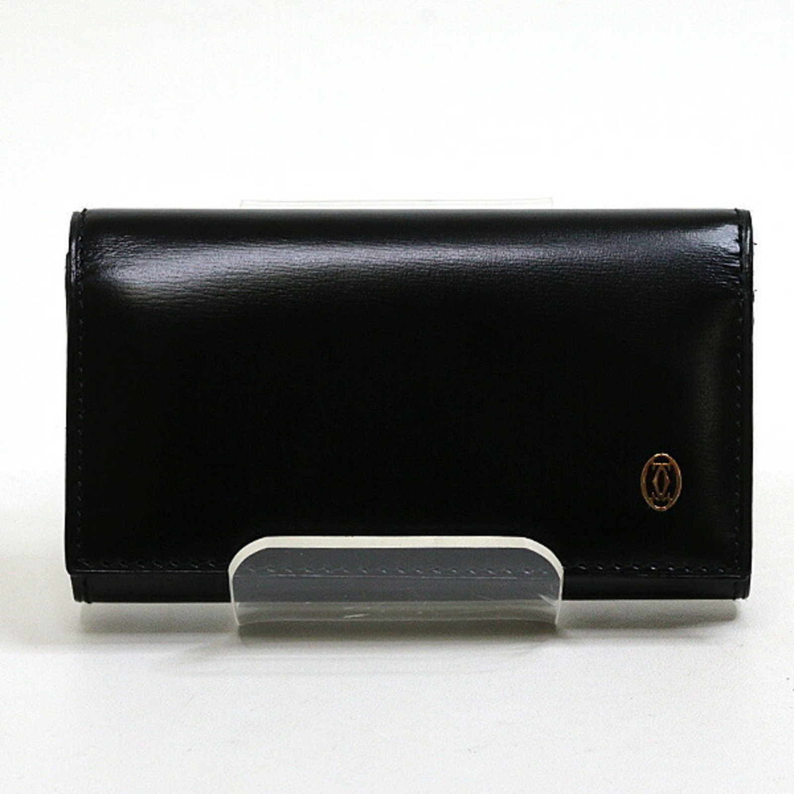 Cartier Keycase Leather: Cartier Keycase Leather Cartier Keycase Leather in black leather, made from high-quality material and in mint condition. This used item has been carefully preserved to maintain its like-new appearance