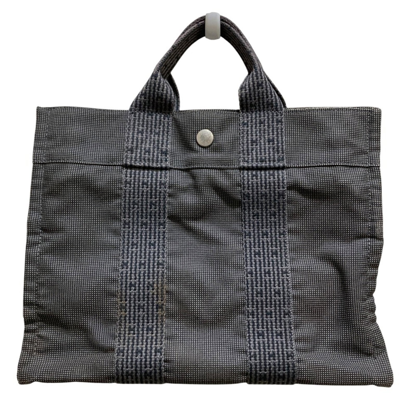 Hermes Handbag: Hermes Handbag Gray Hermes Handbag for Women. This pre-owned handbag features a classic design with a 23cm x 30cm x 8.5cm size and traces of usage, scratches, and dirt. The bag's condition shows signs