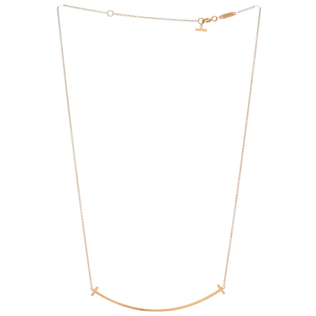 Tiffany Smiles Pendant Necklace 18K Gold Pendant Large: Tiffany Smiles Pendant Necklace 18K Gold Pendant Large The Tiffany & Co. T Smile Pendant Necklace in 18K Rose Gold is a stunning piece of jewelry featuring a large pendant with minor wear throughout. 