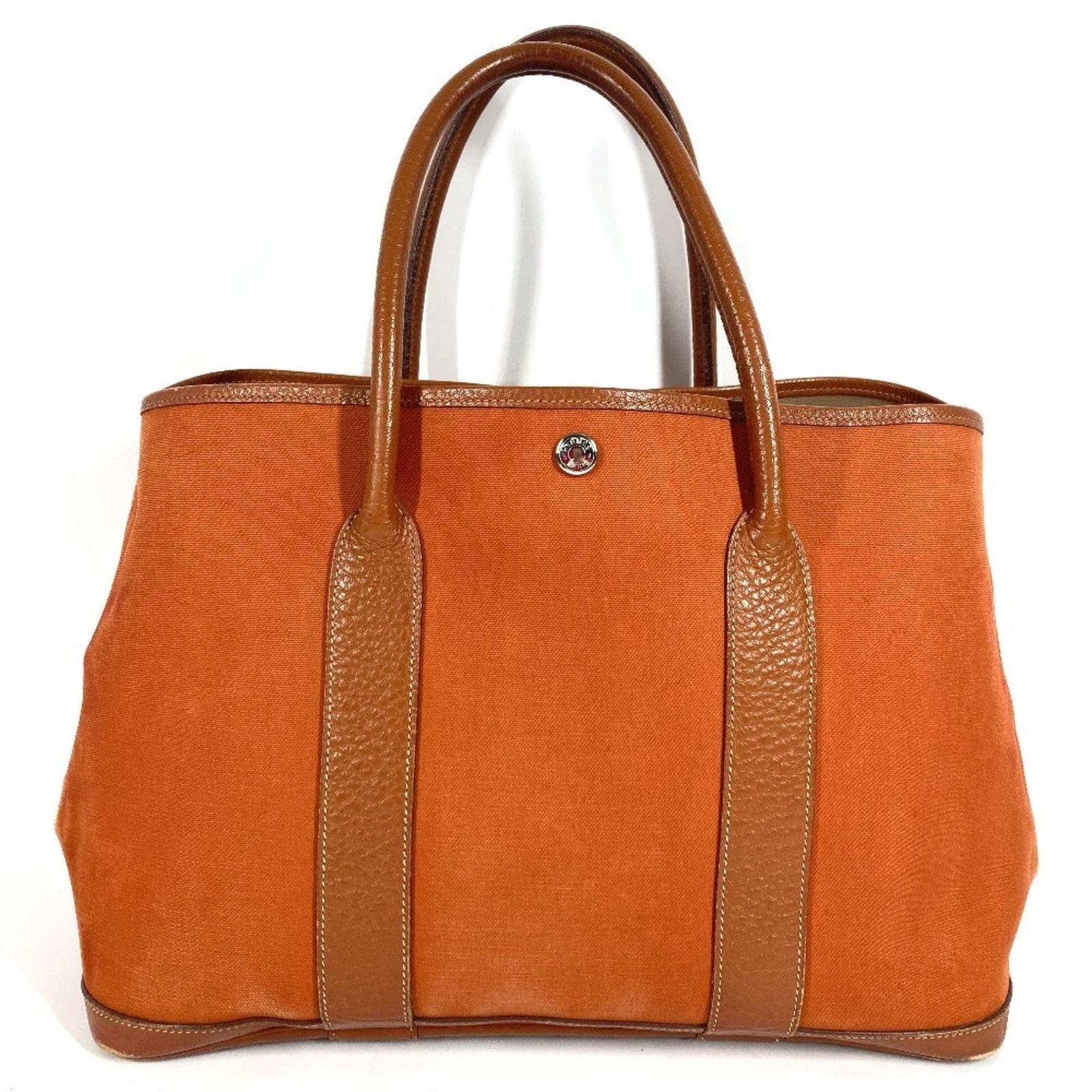 Hermes Handbag Shoulder Bag Tote Bag Canvas Leather: Hermes Handbag Shoulder Bag Tote Bag Canvas Leather Canvas and leather combine in this vibrant orange Hermes shoulder bag tote. With its classic design and durable materials, this used handbag has