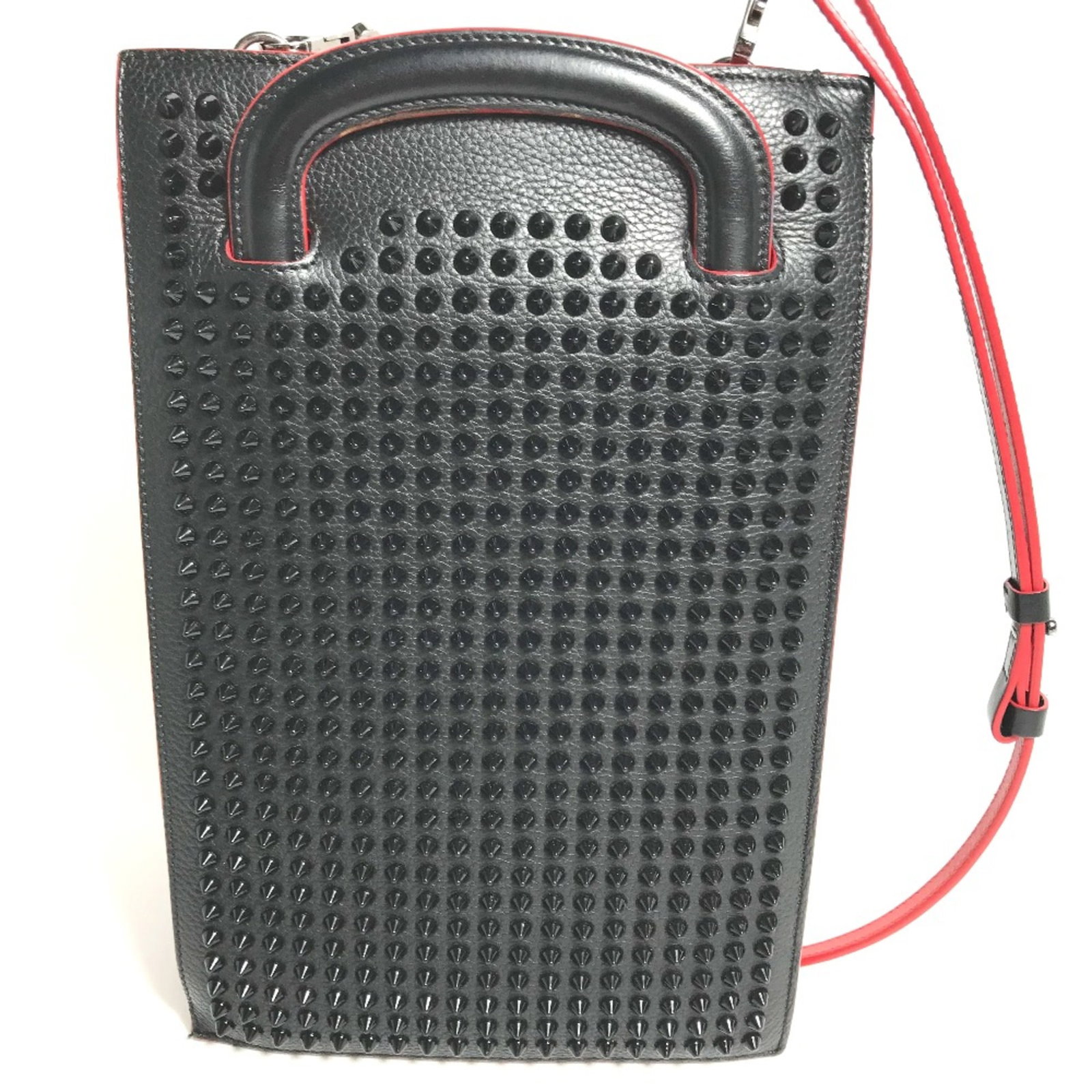 Christian Louboutin Shoulder Bag Leather: Christian Louboutin Shoulder Bag Leather Black leather shoulder bag from Christian Louboutin features a classic design with a long strap. The bag has traces of usage and minor scratches/dirt, but rema