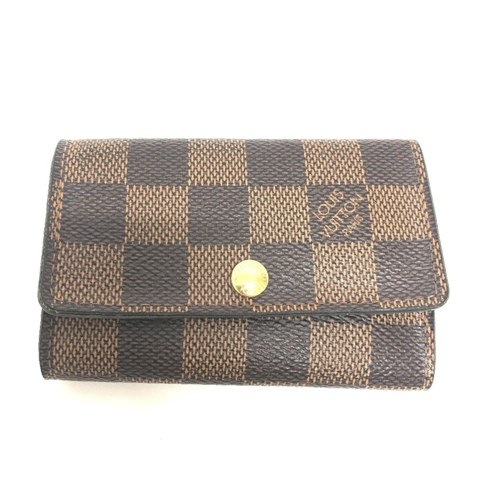 Louis Vuitton Keycase Damier Canvas: Louis Vuitton Keycase Damier Canvas Damier Canvas Damier Keycase in Ebene Brown. This pre-owned Louis Vuitton keycase features six key hooks and is made from durable Damier canvas material. With its