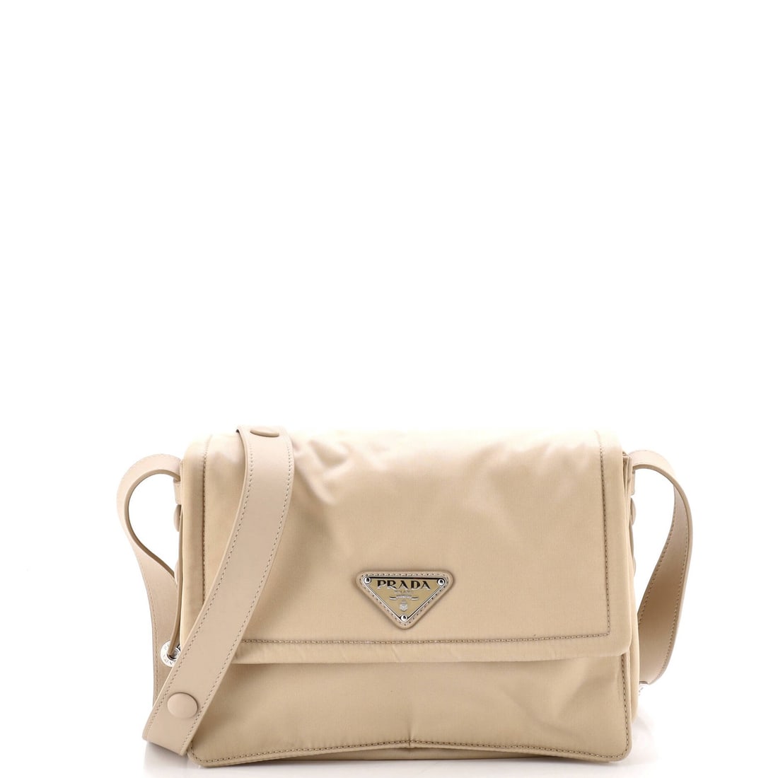 Padded Flap Bag Nylon Small Re: Padded Flap Bag Nylon Small Re Padded flap bag with nylon exterior in neutral color, featuring cross body design and adjustable strap drop. Measuring 6" tall, 9" wide, and 4" deep, this small bag has 