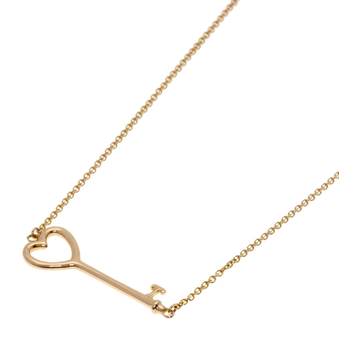 Pink gold necklace with heart key from Tiffany&Co. K18: Pink gold necklace with heart key from Tiffany&Co. K18 K18 pink gold necklace with a heart-shaped key from Tiffany&Co. showcases elegant design simplicity. The 15.7-inch length offers versatility for 
