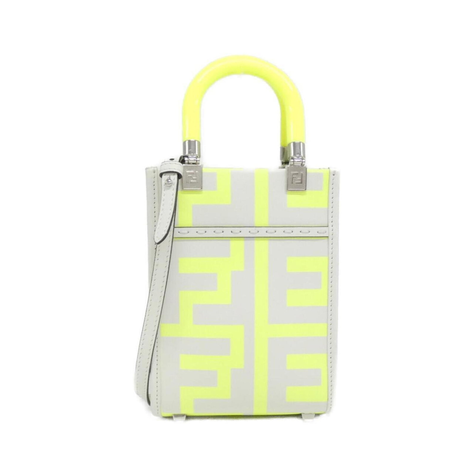 Fendi Handbag Leather: Fendi Handbag Leather White and yellow Fendi handbag leather in excellent condition, with a few subtle scratches and minor dirt marks. The silver hardware adds a touch of sophistication to this classi