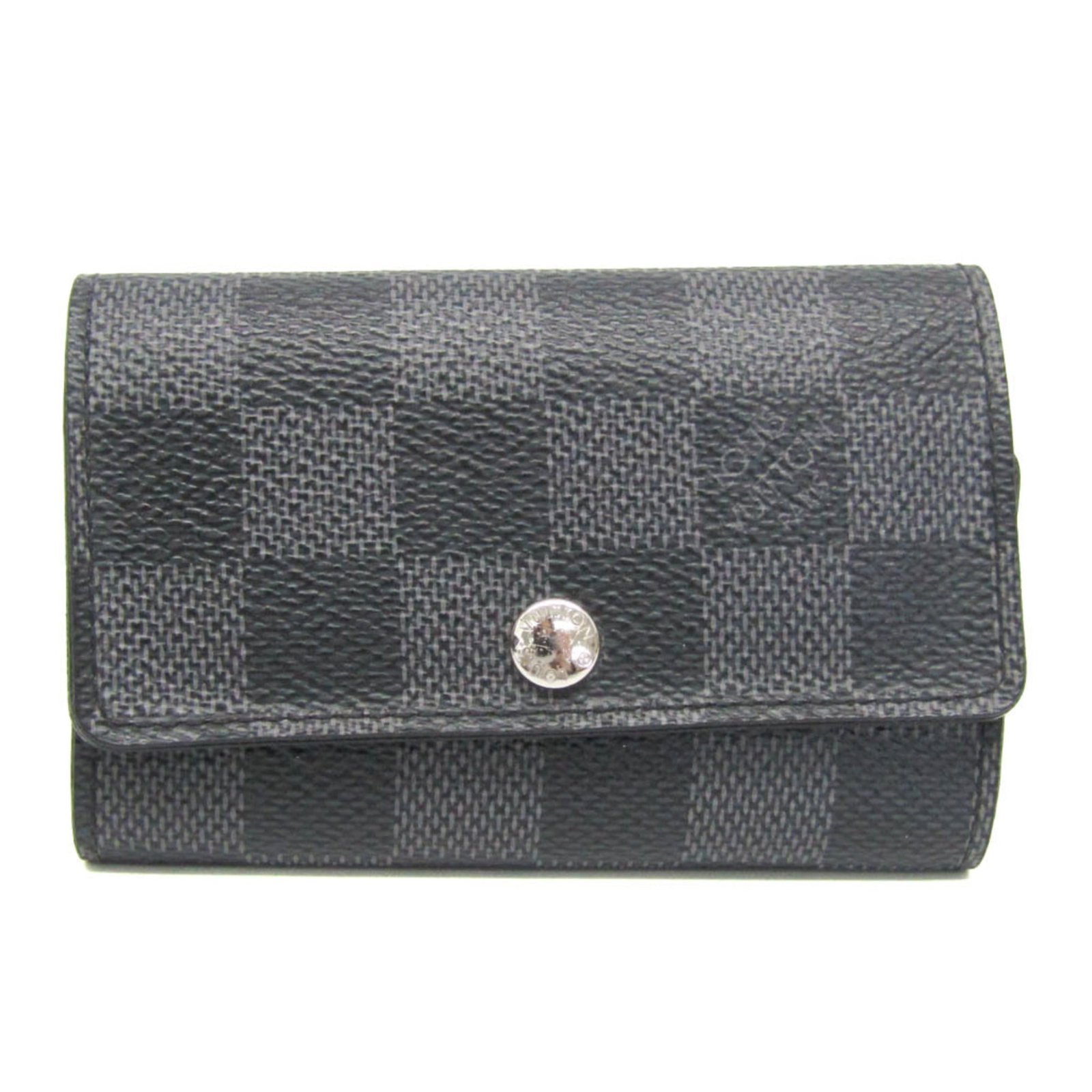Louis Vuitton Keycase Damier Graphite: Louis Vuitton Keycase Damier Graphite Damier Graphite leather wraps around this Louis Vuitton Keycase, adding a touch of timeless elegance to daily essentials. With six key hooks and a snap closure, i