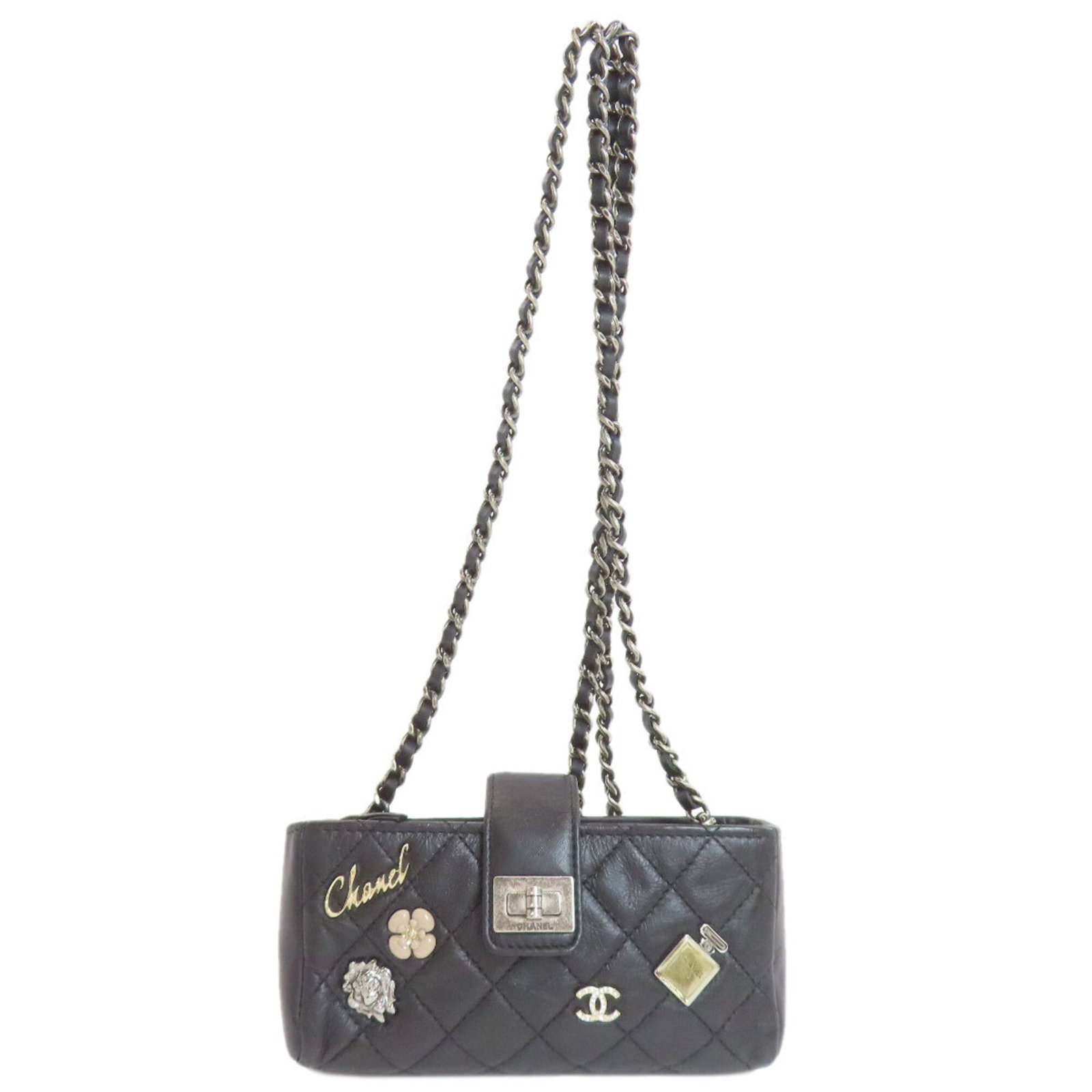 Chanel Shoulder Bag Leather: Chanel Shoulder Bag Leather This classic Chanel shoulder bag features high-quality lambskin leather in black. With its timeless design and sturdy construction, it has been well-loved over time, showin