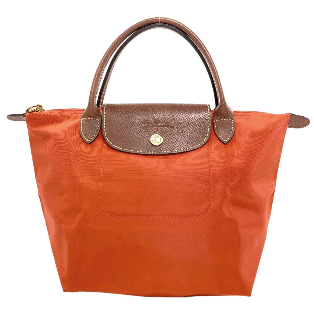 Handbag Nylon Le Pliage Longchamp: Handbag Nylon Le Pliage Longchamp Nylon Le Pliage Longchamp handbag in vibrant orange exterior. This iconic style features durable construction and versatile design, making it perfect for everyday