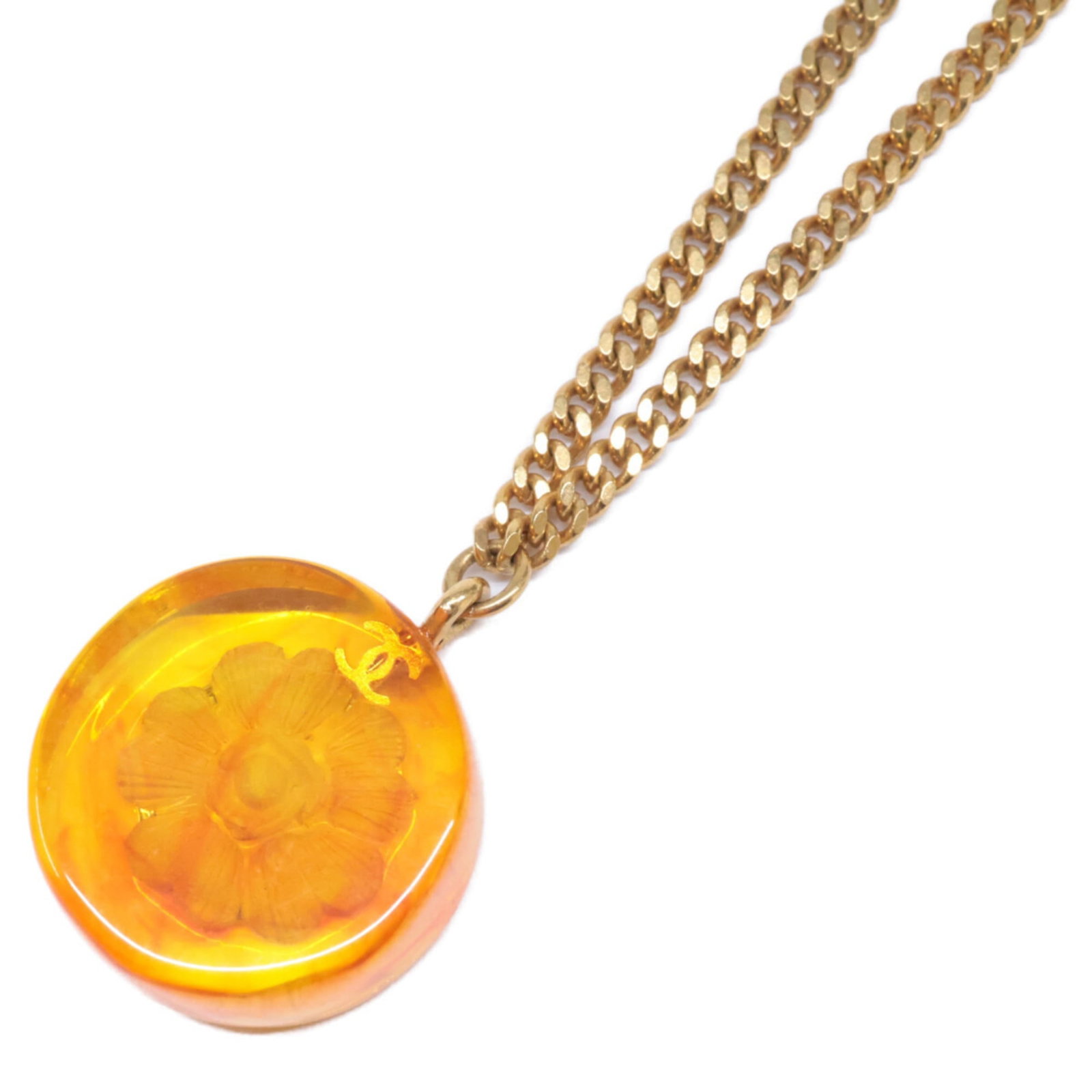 Chanel 98A Coco Mark Amber Camellia Design Necklace In Orange And Gold For Women: Chanel 98A Coco Mark Amber Camellia Design Necklace In Orange And Gold For Women Gold and orange hues evoke a sense of luxury in this Chanel 98A Coco Mark Amber Camellia Design Necklace. The resin mat