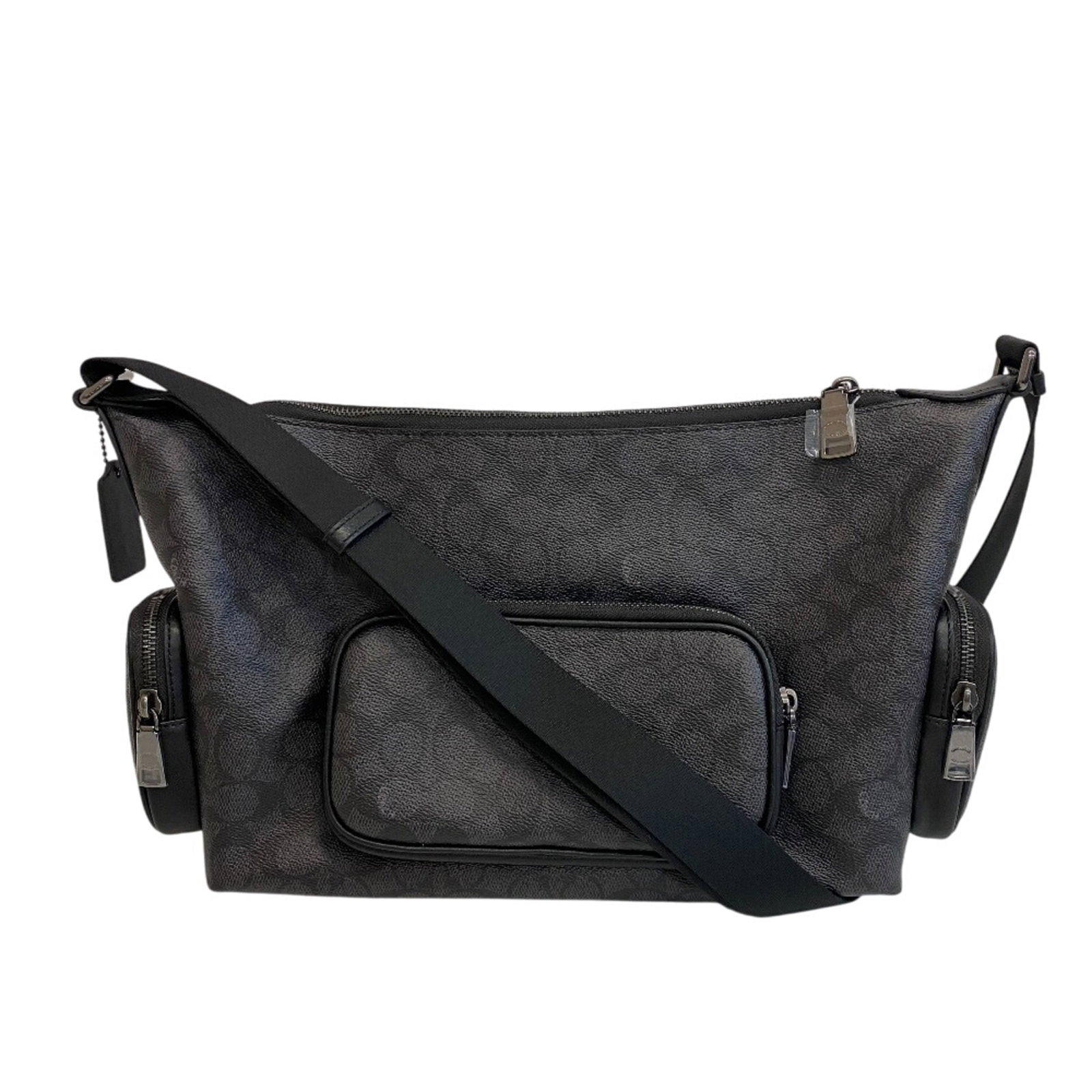 Coach Shoulder Bag Sling Bag Pvc Coated Canvas: Coach Shoulder Bag Sling Bag Pvc Coated Canvas The Coach Shoulder Bag Sling Bag features a unique blend of Pvc and coated canvas material, giving it a distinctive look. Available in black and gray