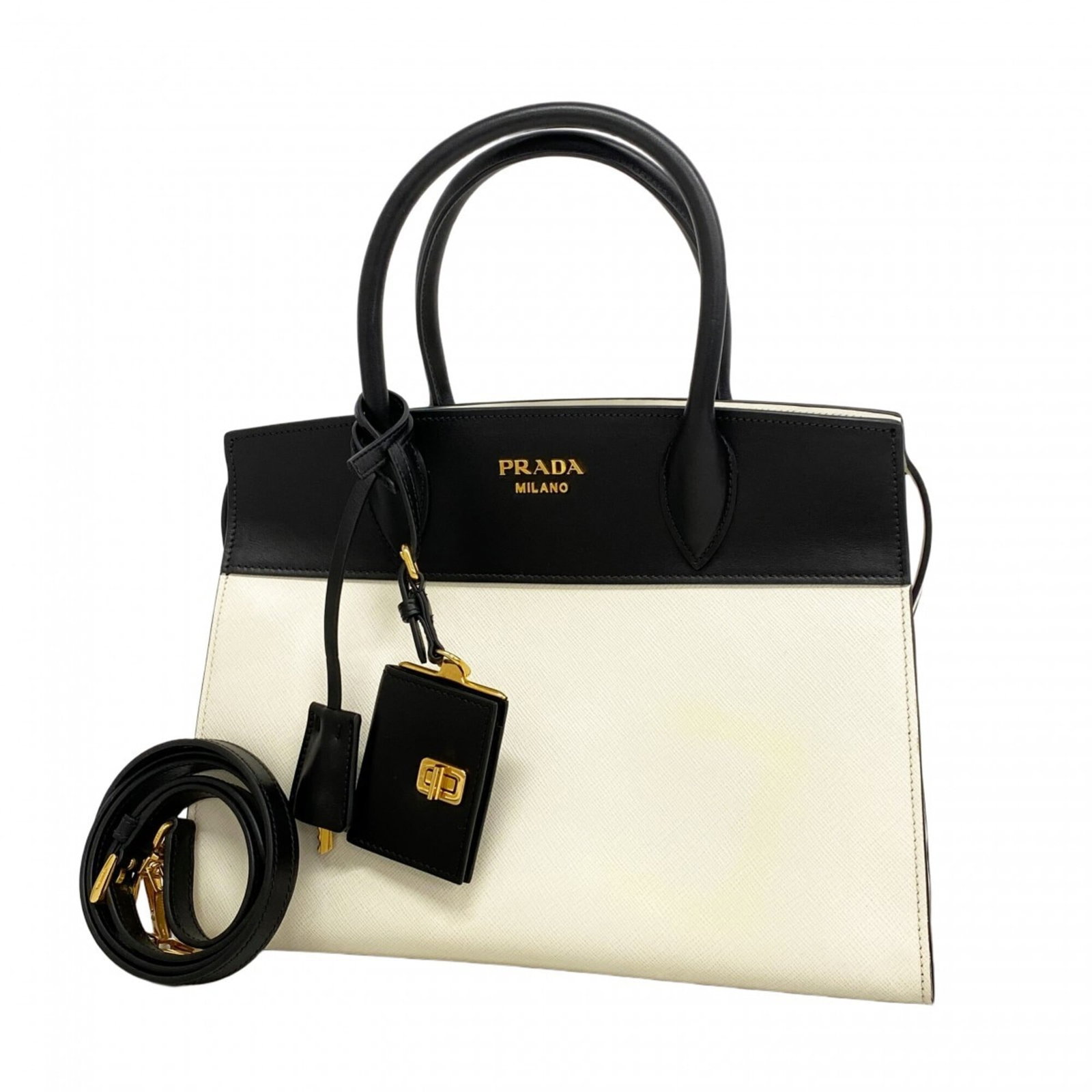 Prada Handbag Leather: Prada Handbag Leather Black and gold Prada handbag made from high-quality leather. The bag has some traces of usage with scratches and dirt visible, but remains in good condition overall. Its classic 