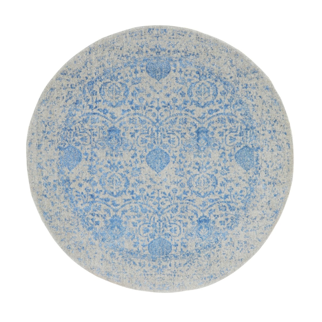 Blue Jacquard Hand Loomed Wool Silk Pomegranate Round Rug: Blue Jacquard Hand Loomed Wool Silk Pomegranate Round Rug The Blue Jacquard Hand Loomed Wool Silk Pomegranate Round Rug boasts an intricate Indian weave pattern in a striking blue hue. Measuring 5'9" 