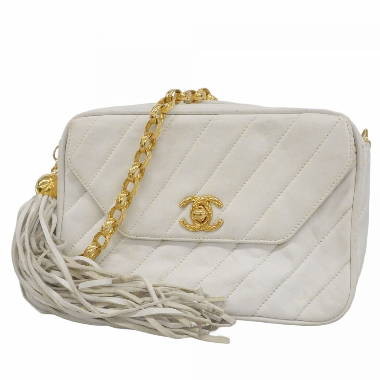 Chanel Shoulder Bag Leather: Chanel Shoulder Bag Leather Chanel's iconic shoulder bag features a crisp white lambskin exterior with subtle scratches and minor dirt marks. The gold hardware adds a touch of sophistication to this
