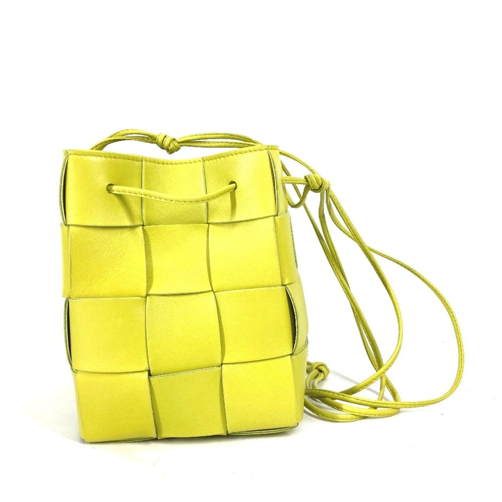 Bottega Veneta Pochette Shoulder Bag Leather: Bottega Veneta Pochette Shoulder Bag Leather Bottega Veneta's iconic Pochette shoulder bag in light green leather offers a stylish and versatile accessory. With its classic design and durable material