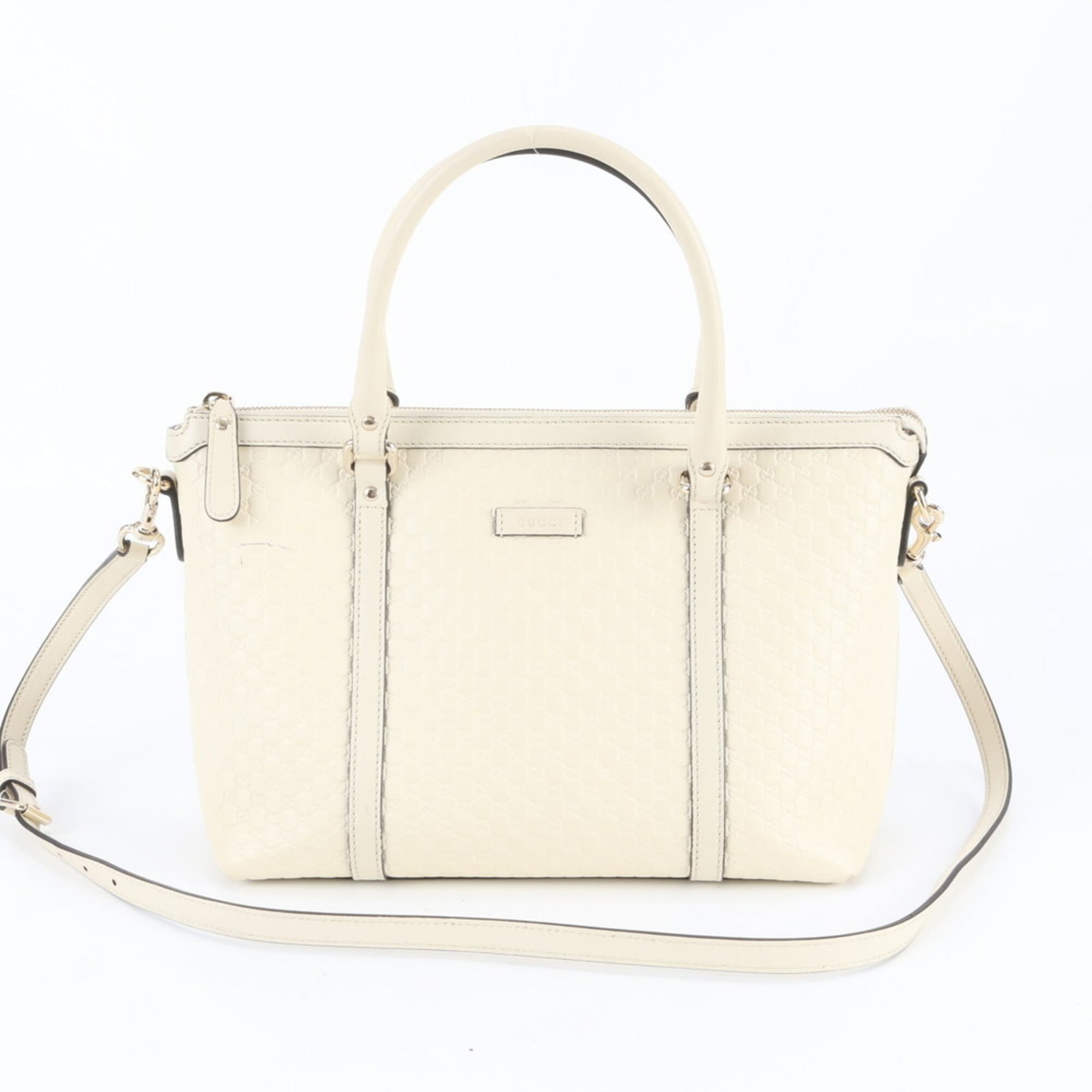 Gucci Shoulder Bag Tote Bag Leather: Gucci Shoulder Bag Tote Bag Leather Gucci's iconic shoulder bag tote features high-quality leather in a timeless cream color. With its classic design and durable construction, this stylish accessory