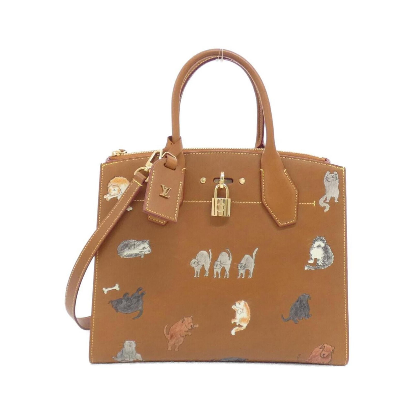 Louis Vuitton Handbag Leather: Louis Vuitton Handbag Leather Camel-colored calf leather Louis Vuitton handbag with gold hardware, featuring a classic design and sturdy construction. This pre-owned bag has some minor scratches and d