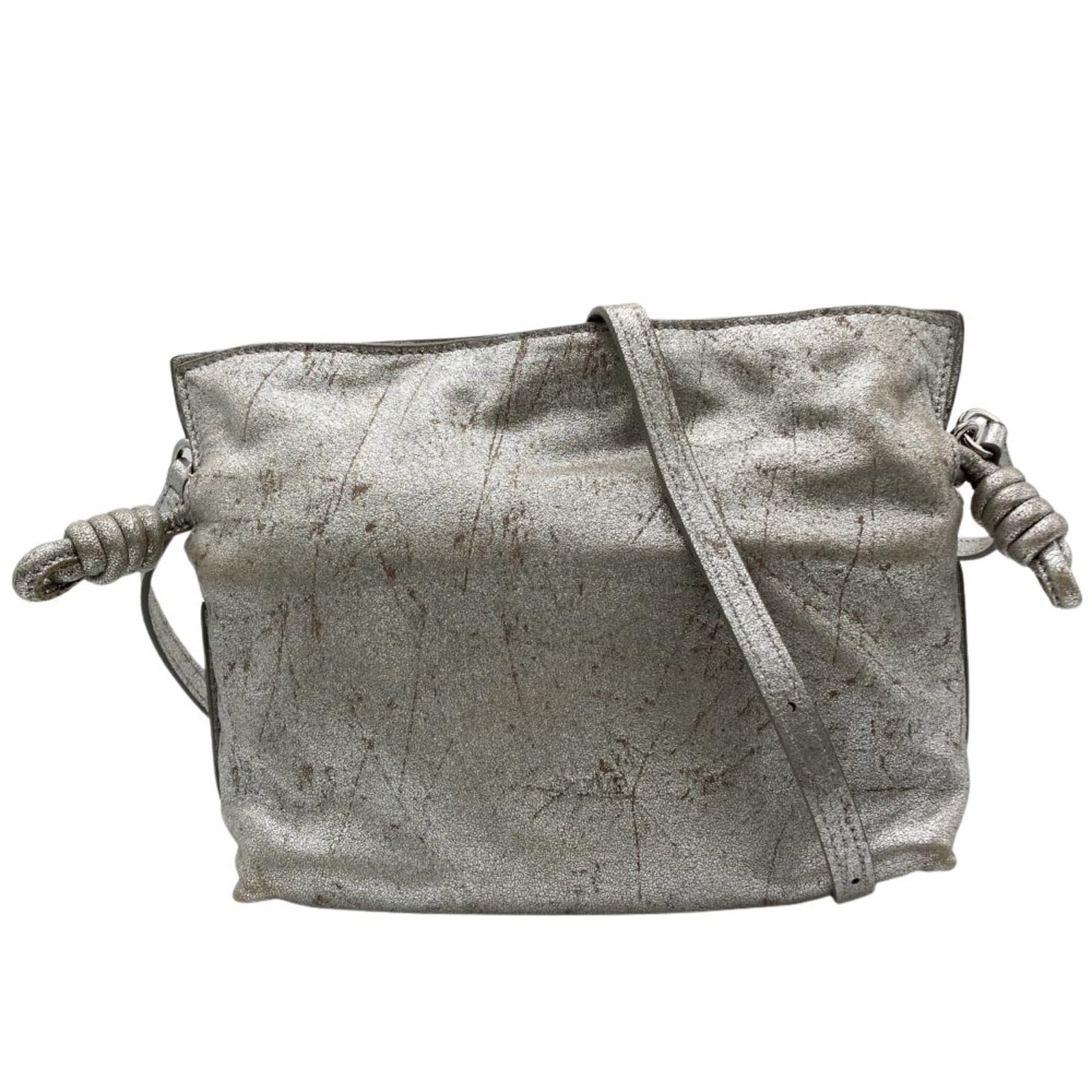 Loewe Shoulder Bag Leather: Loewe Shoulder Bag Leather The Loewe Shoulder Bag Leather features a sleek silver color and a sturdy magnet closure. With its classic design and spacious interior, this shoulder bag is perfect for eve