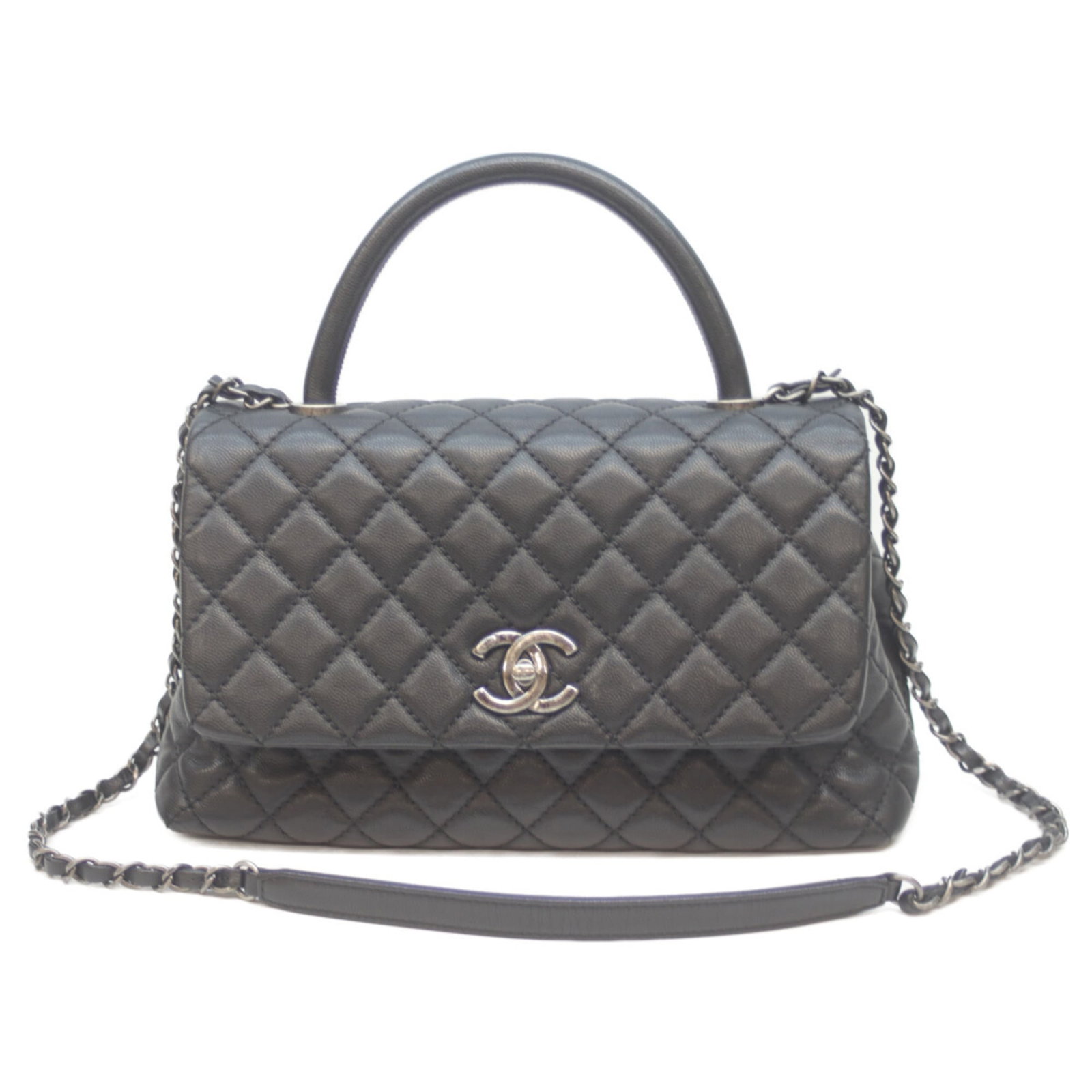 Chanel Handbag Grained Calfskin: Chanel Handbag Grained Calfskin Grained Calfskin Chanel Handbag in Black. This used handbag features traces of usage and minor scratches, with some dirt visible. Its classic design and timeless style 
